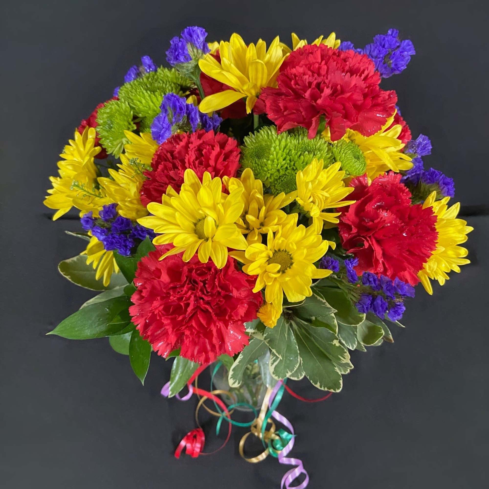 Celebrate a special birthday in style with this arrangement of yellow daisies