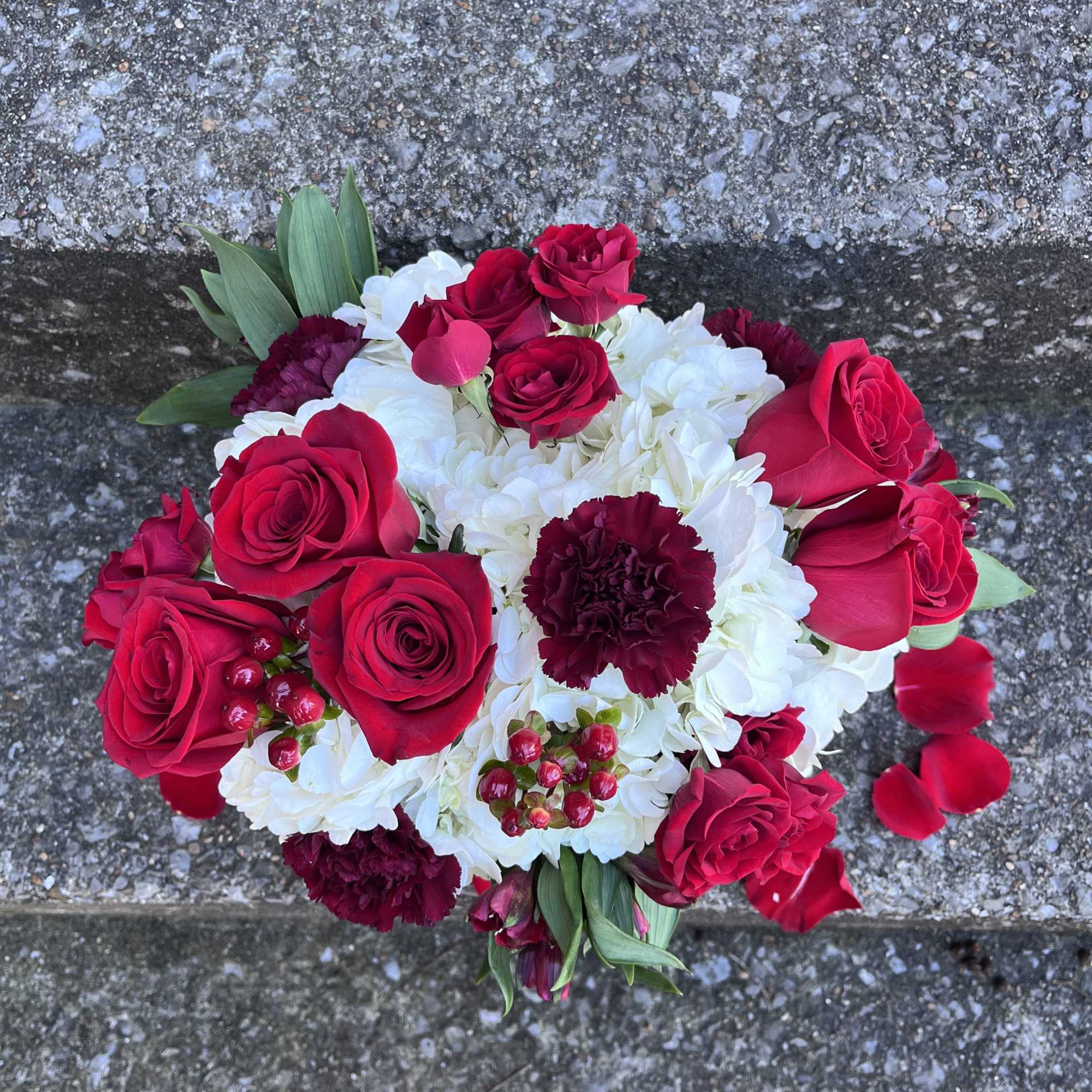 This beautifully designed arrangement is filled with hydrangeas roses, alstroemeria, spray, roses