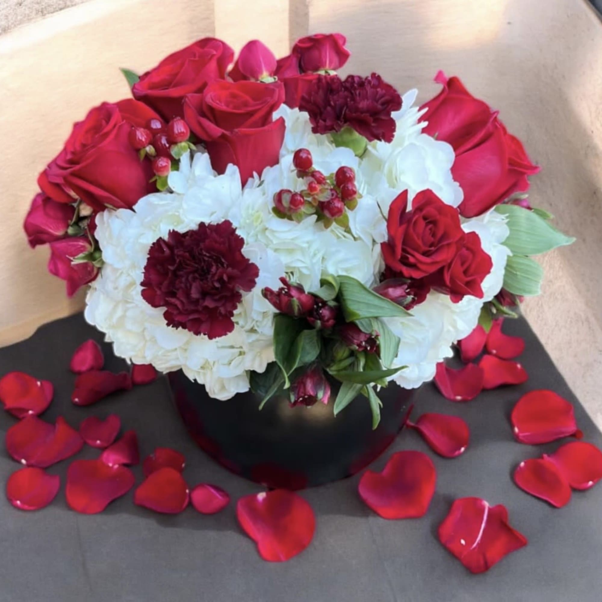 This beautifully designed arrangement is filled with hydrangeas roses, alstroemeria, spray, roses