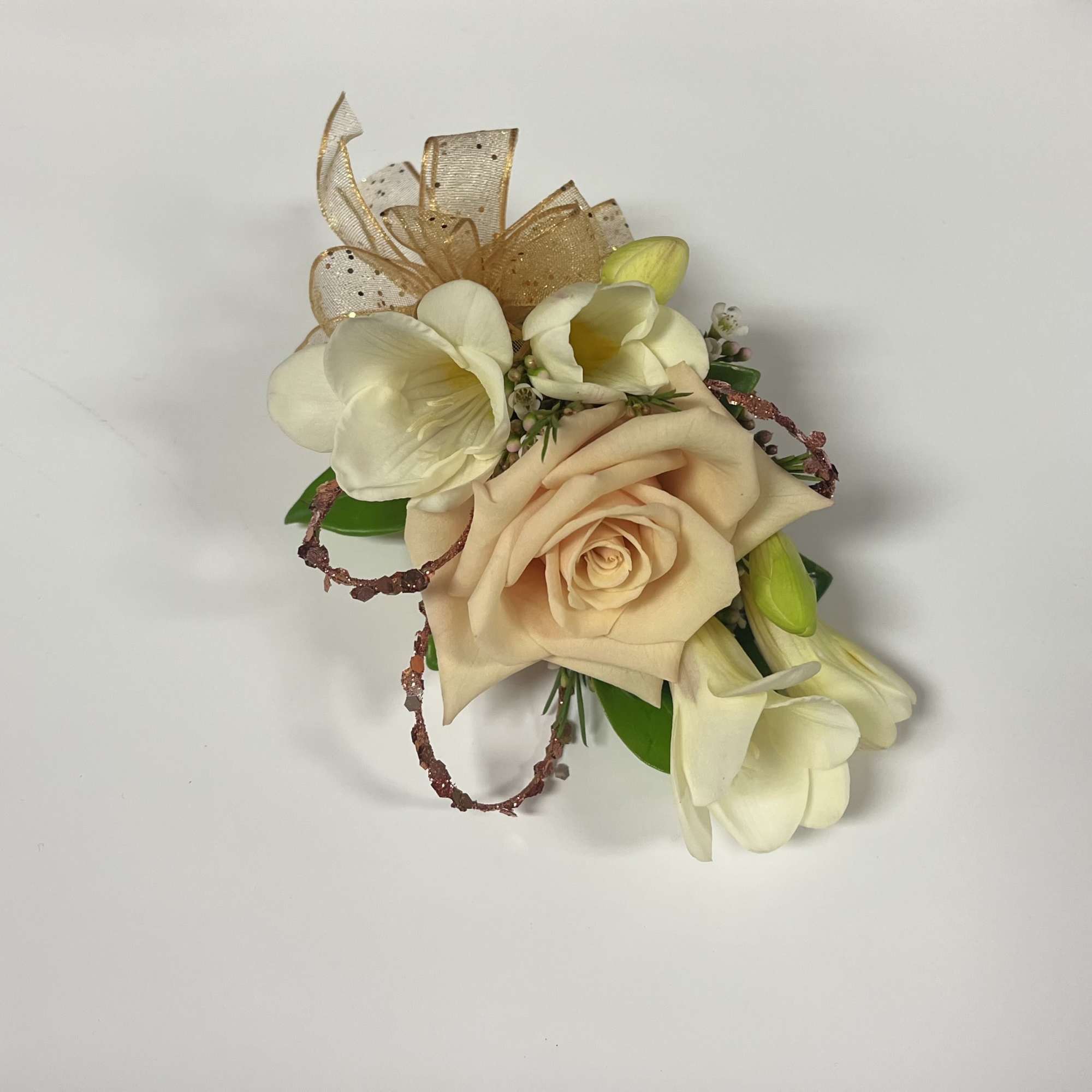 Pictured: Dusty sahara, red, and white rose with white freesia.
Rose colors available: