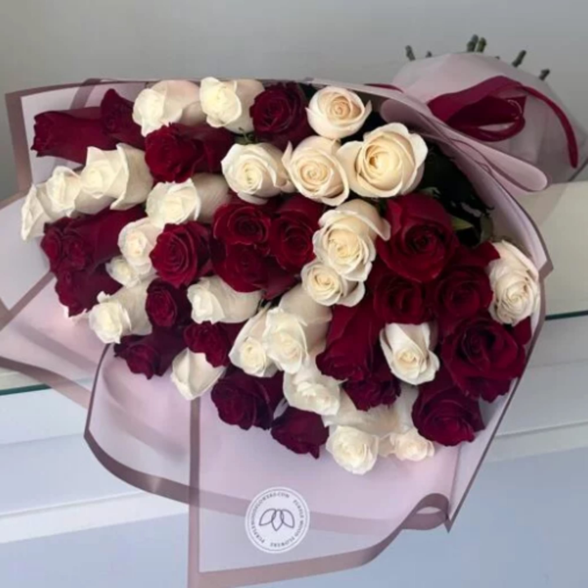 50 Roses.

Red &amp; White Roses
Elegant and timeless, the Red &amp; White Roses