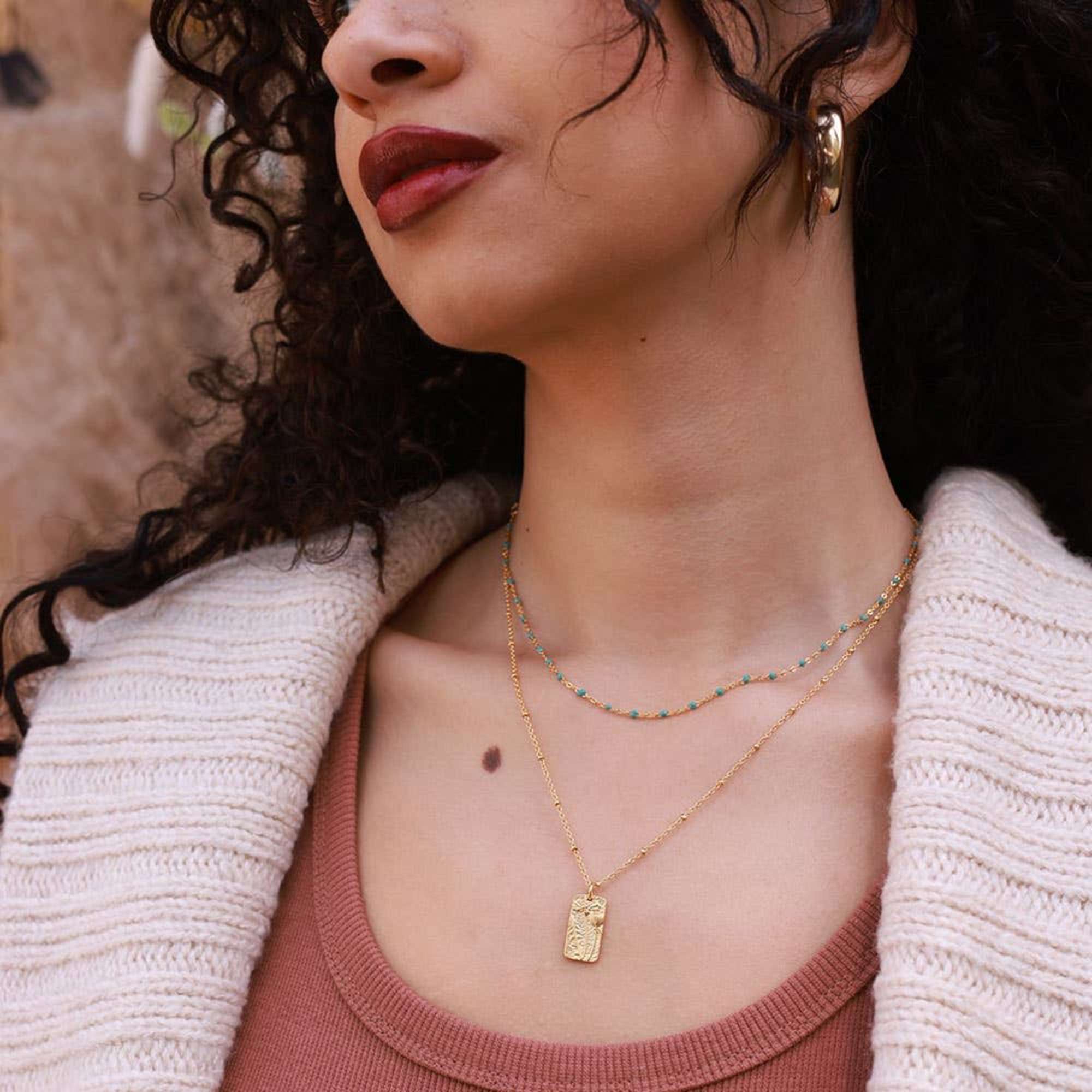 This beautiful flower medallion layers beautifully or is a sweet, simple statement