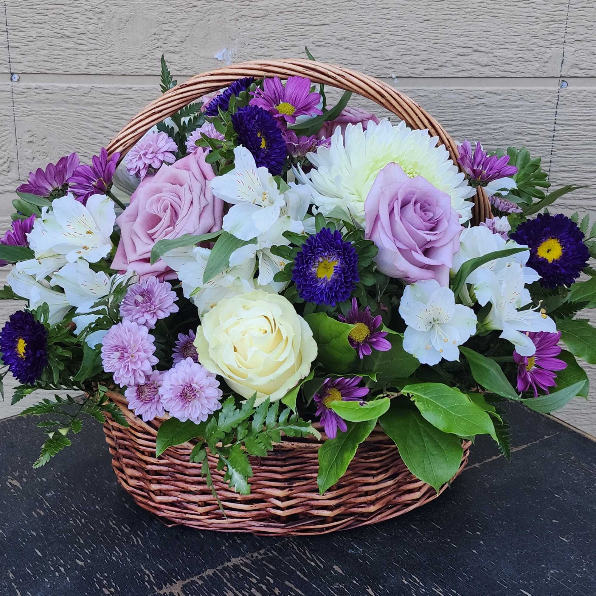 Designer's Choice of mix flowers variety colors in wicker basket
