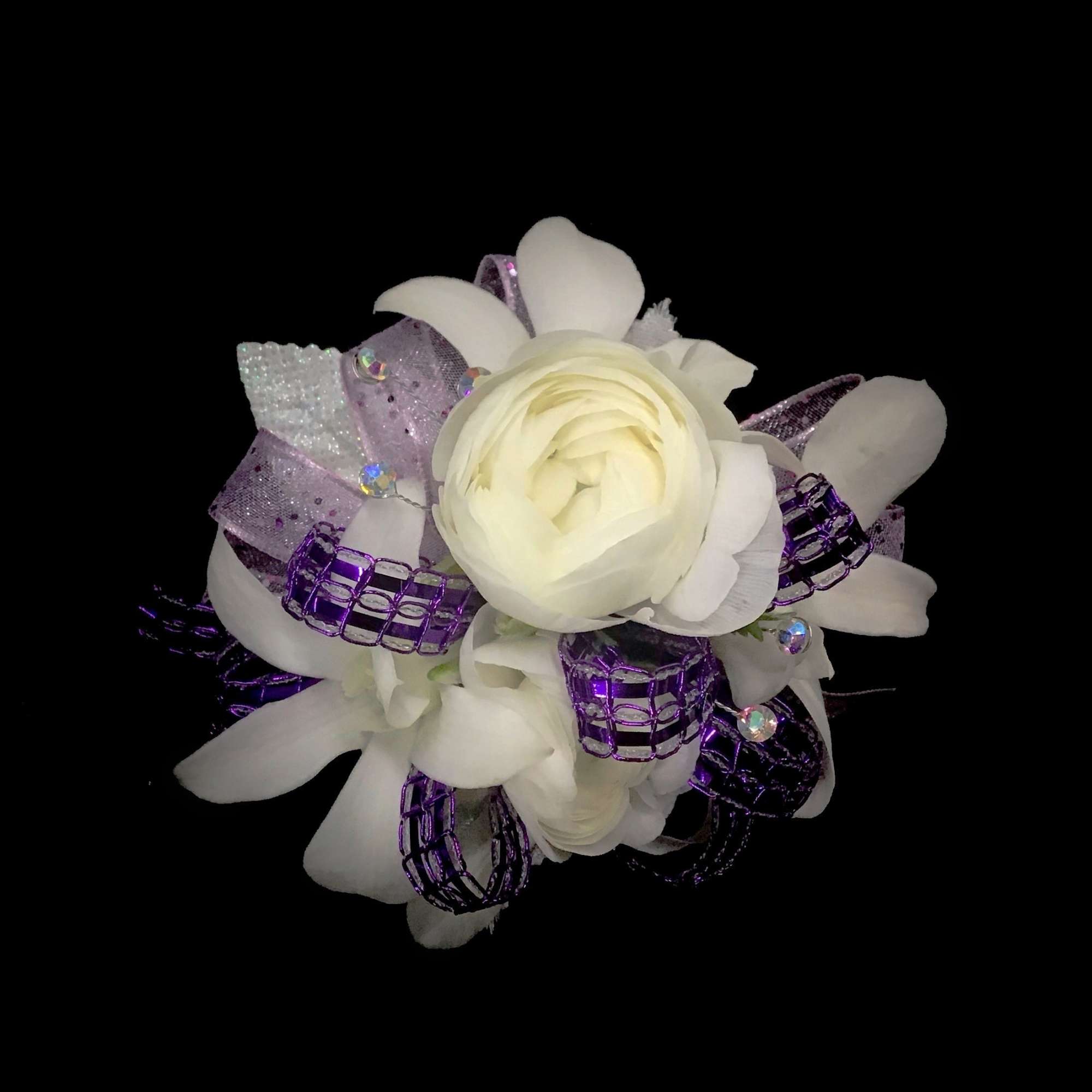 A rhinestone elastic wrist band with lavender, purple and white flowers. Please