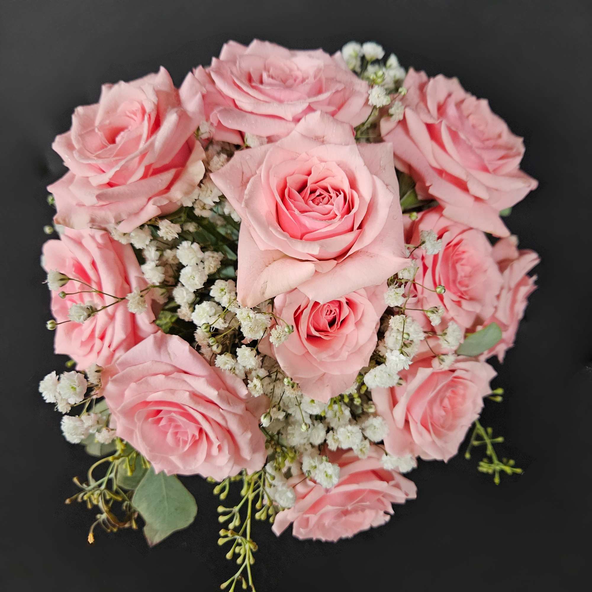 A classic 5 stem spray rose bouquet hand-tied with satin ribbon that