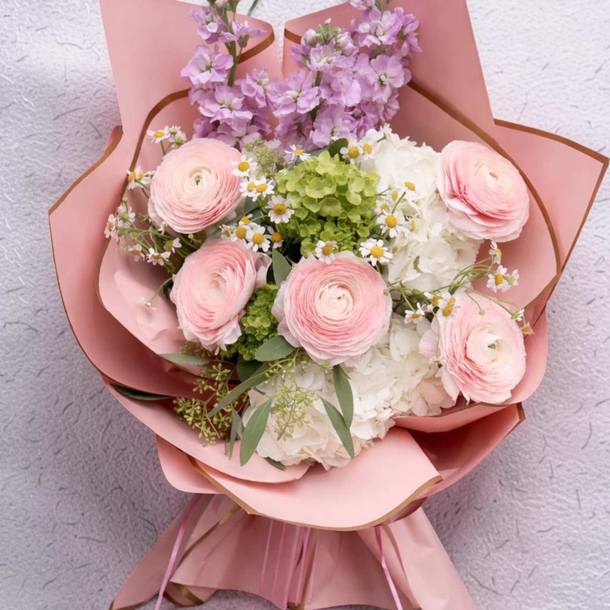 A soft and elegant hand-wrapped bouquet designed especially for Columbia University graduates.