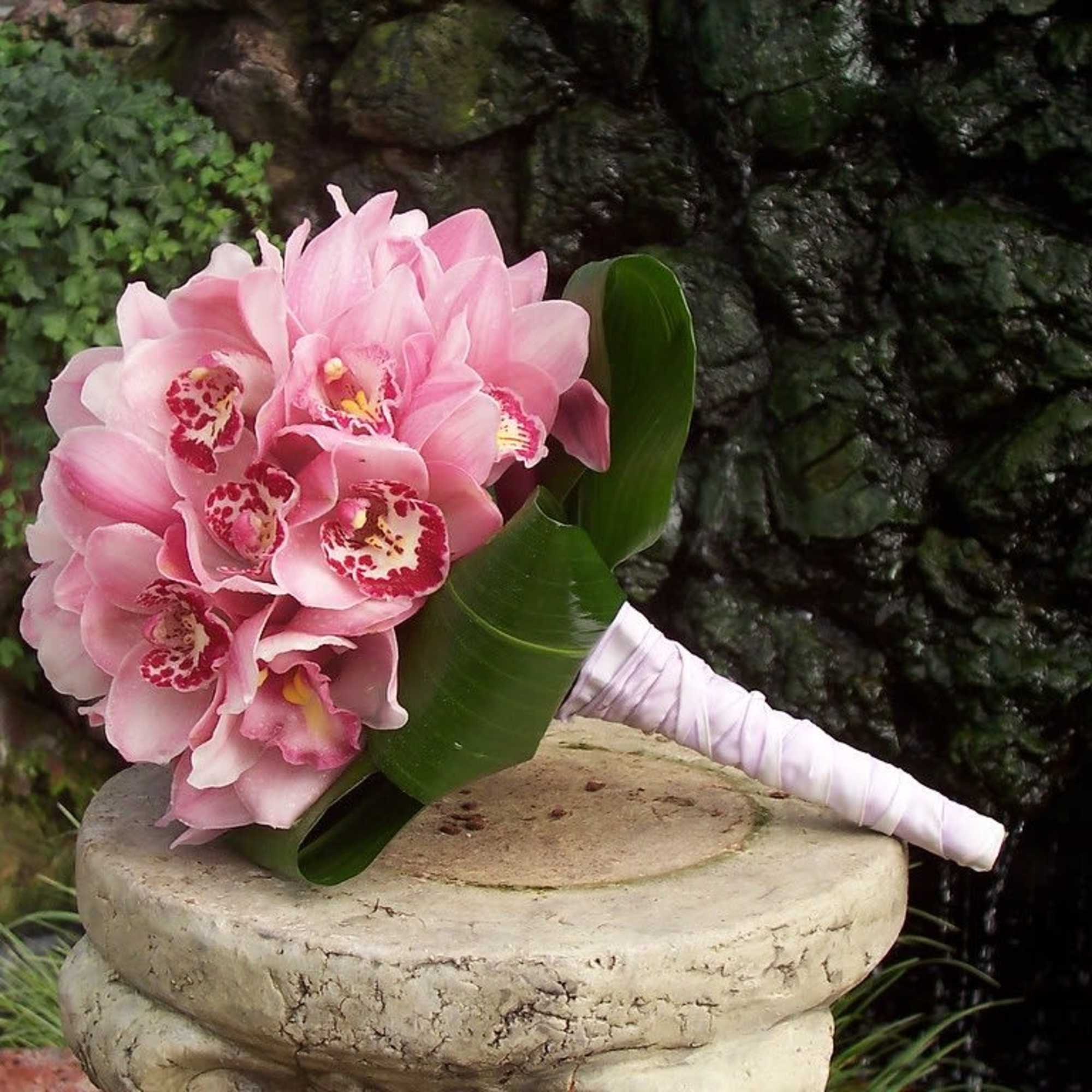 Modern and Crisp pave style bouquet. A modern Take on Cymbidium orchids