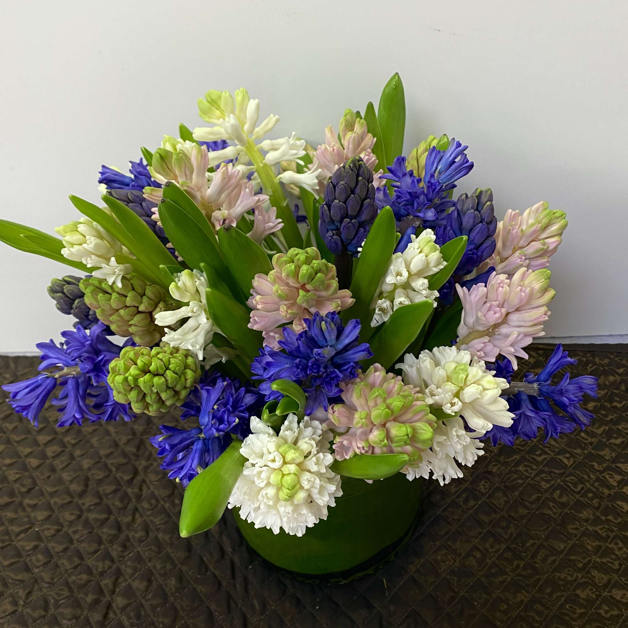 In a pink vase  30 stem hyacinths ( but can be