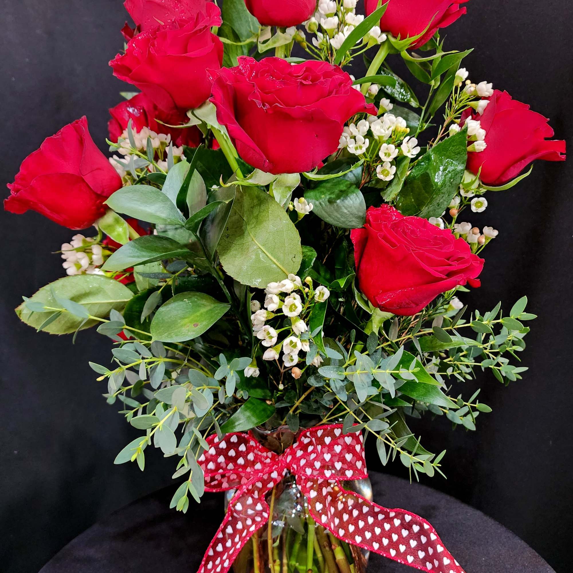 1 dozen large roses in a vase for the classic souls. Eriostemon
