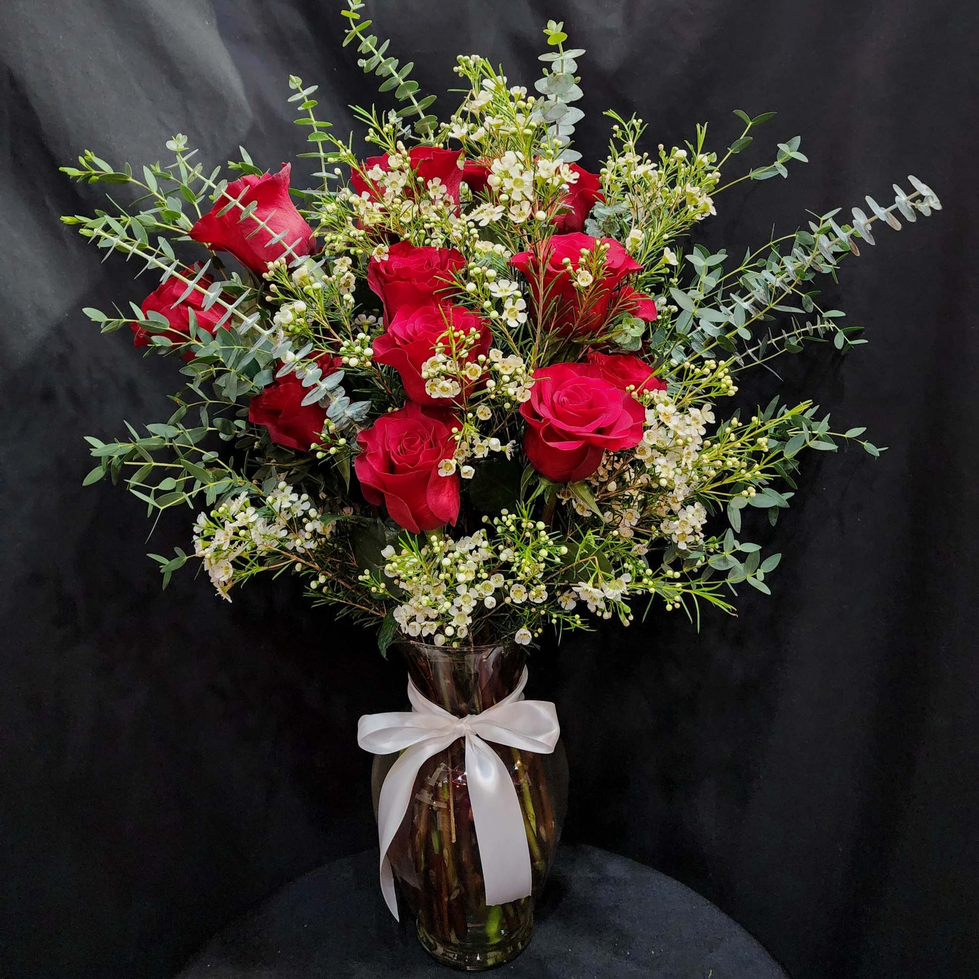 1 dozen large roses in a vase for the classic souls. Eriostemon