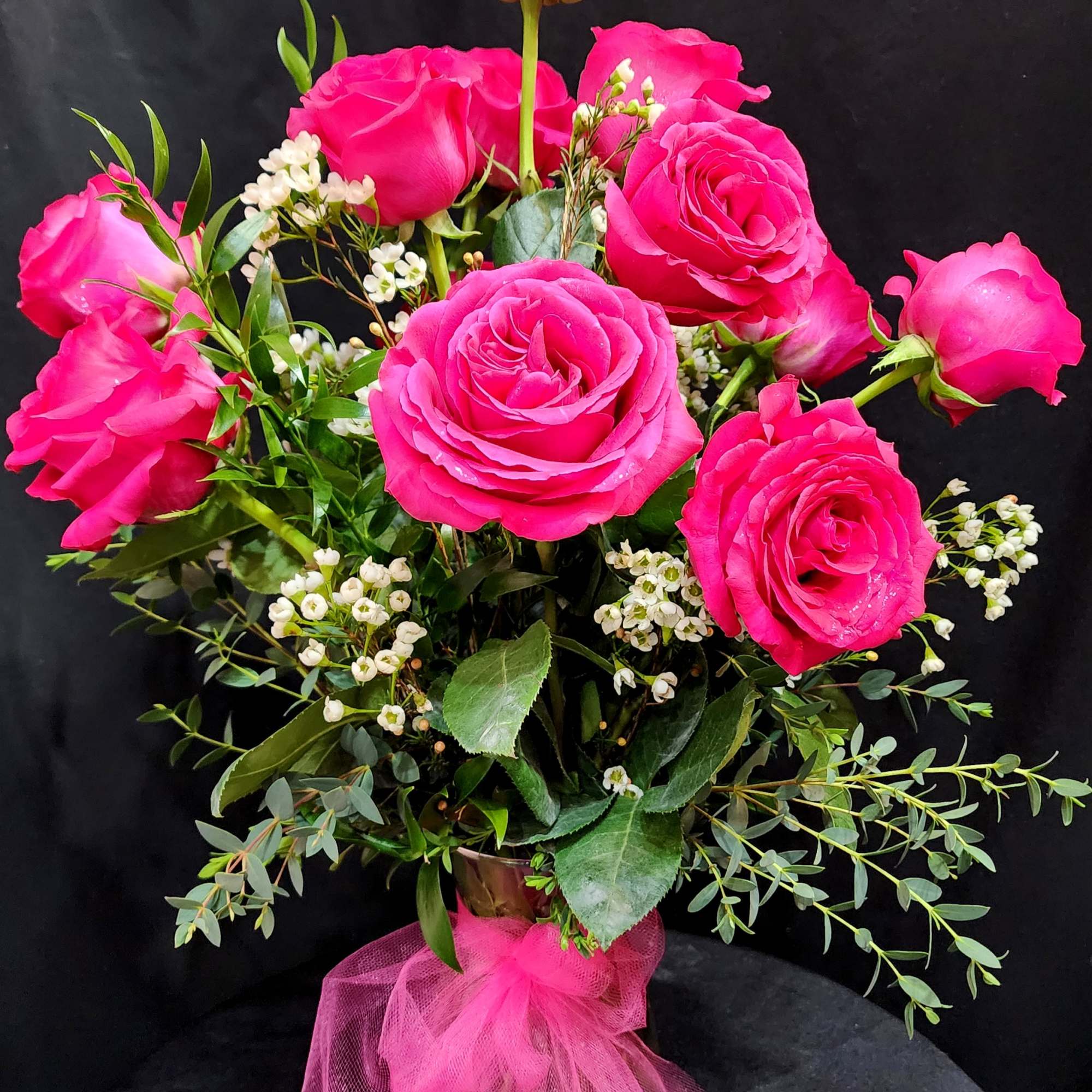 1 dozen large roses in a vase for the classic souls. Eriostemon