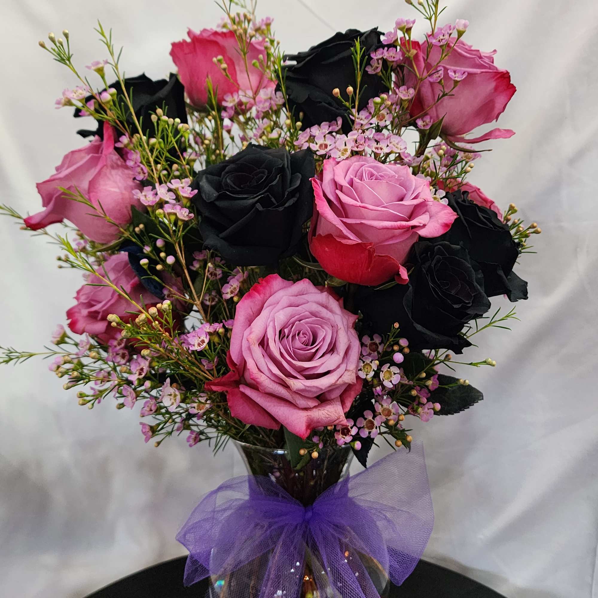 1 dozen large roses in a vase for the classic souls. Eriostemon