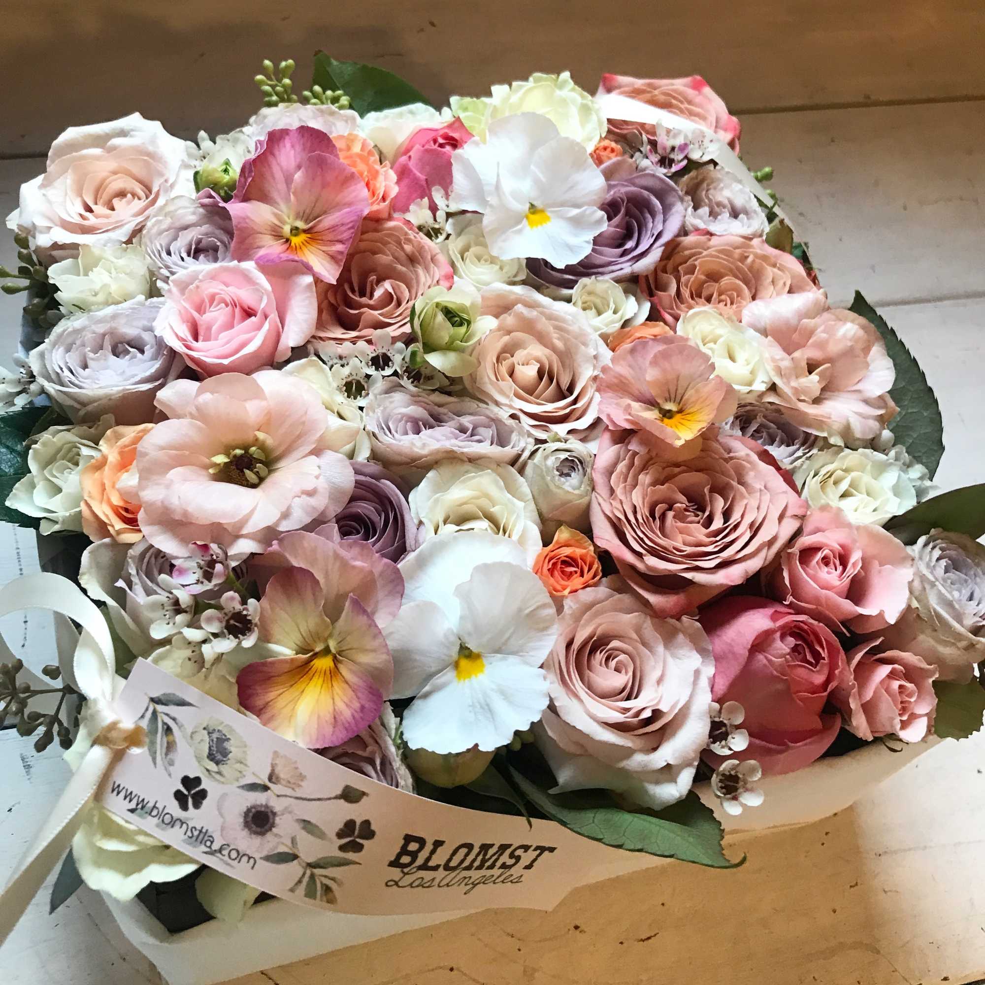 Beautiful blooming signature Blomst flower box full of fresh flowers in a