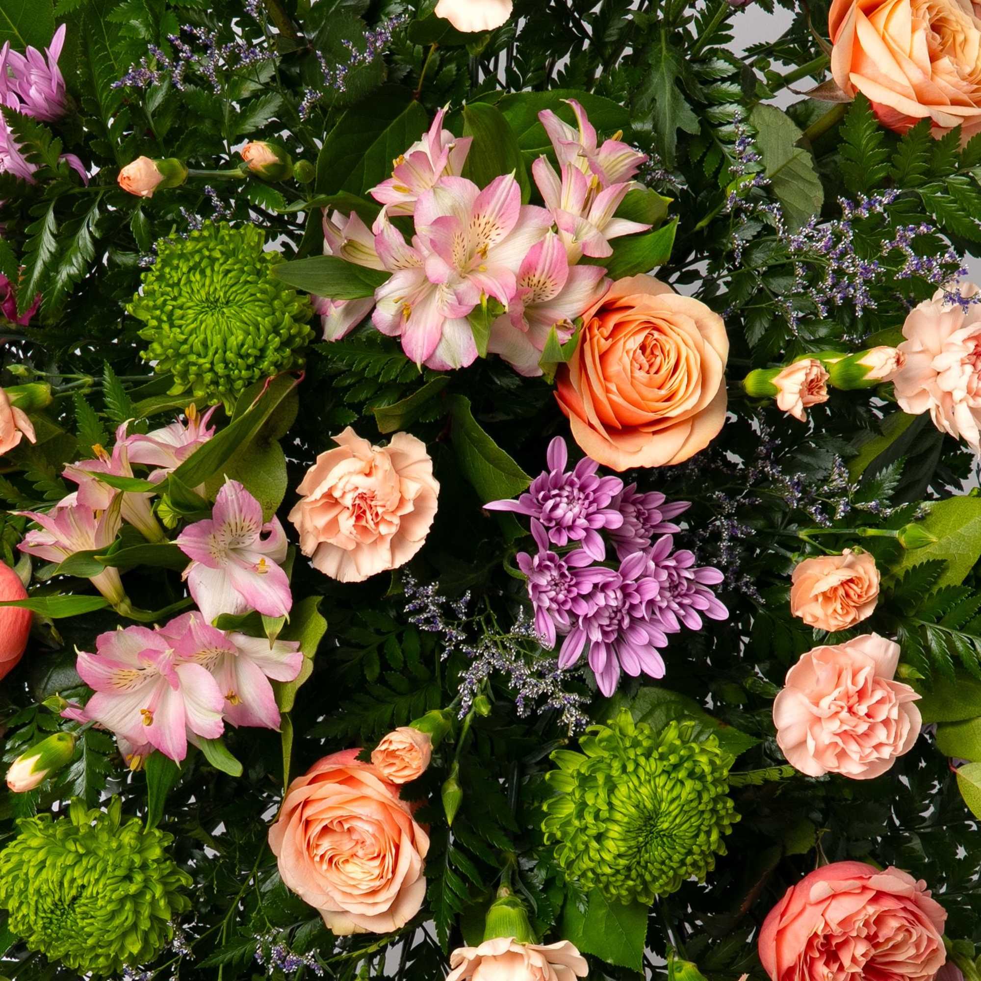 Soft and inviting, this pastel standing spray offers a gentle expression of