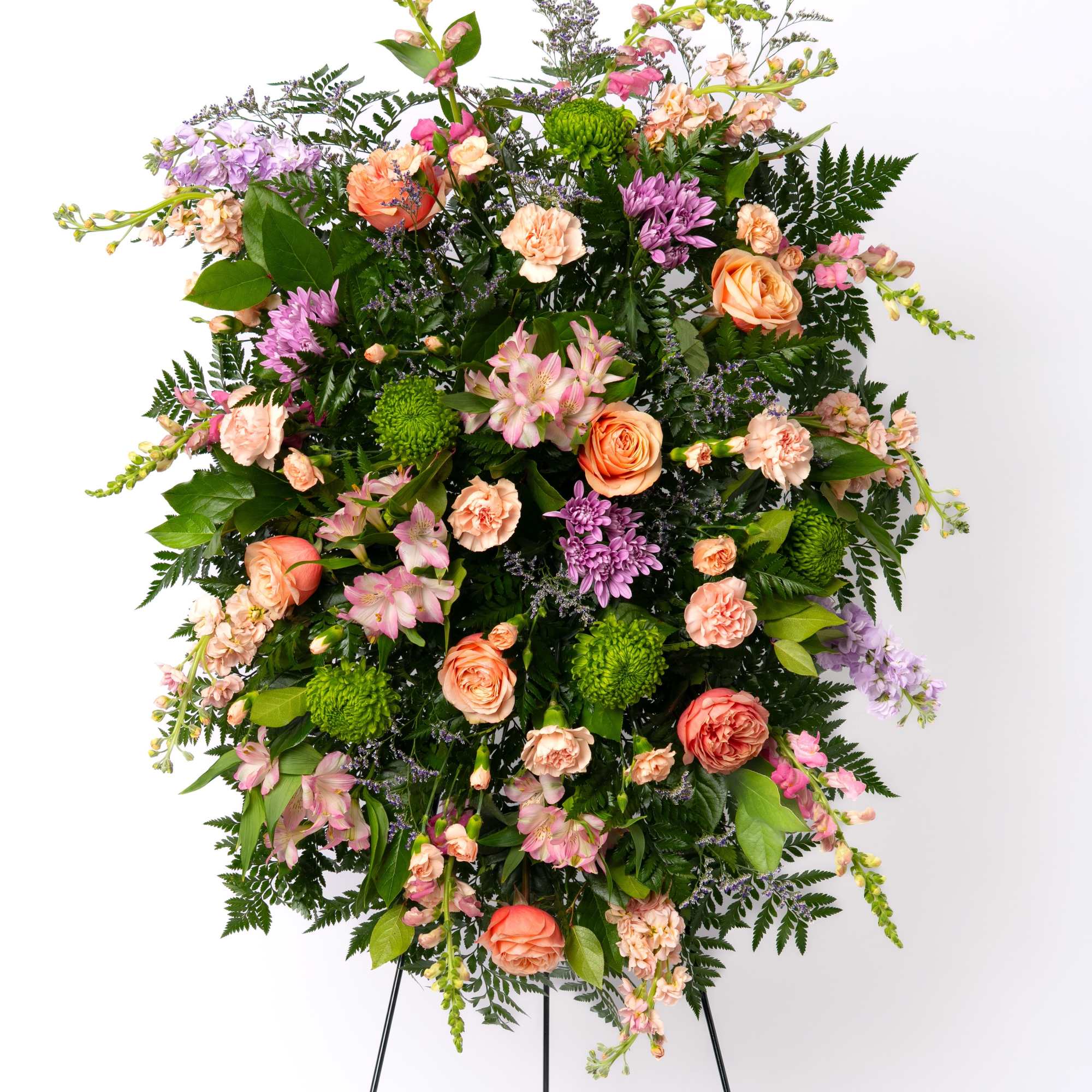 Soft and inviting, this pastel standing spray offers a gentle expression of