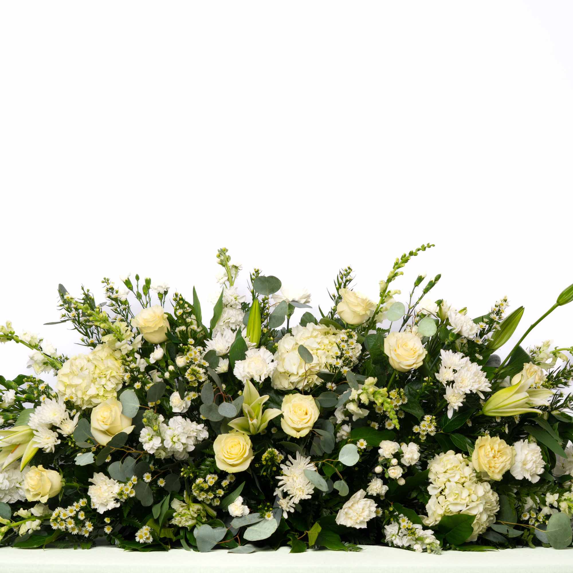 A classic and elegant tribute, this full casket spray is designed with
