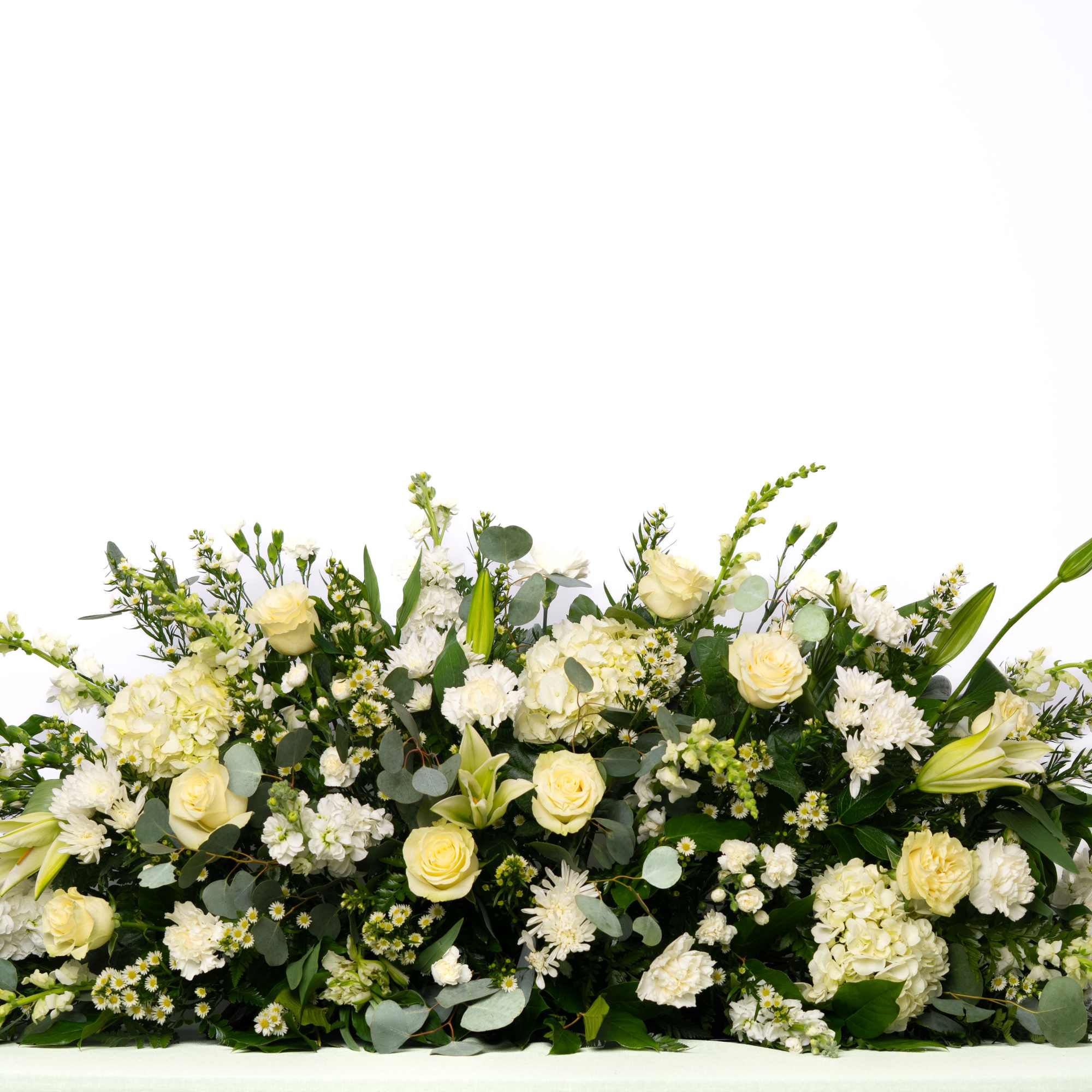 A classic and elegant tribute, this full casket spray is designed with