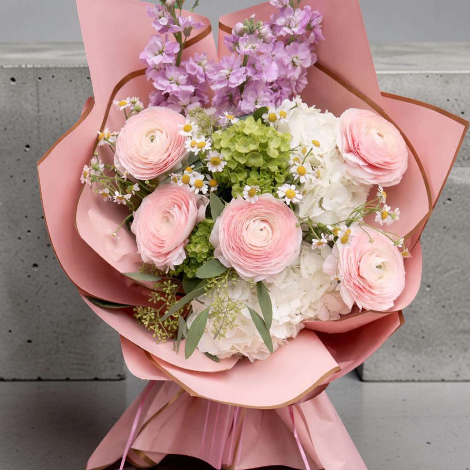 A soft and elegant hand-wrapped bouquet designed especially for Columbia University graduates.