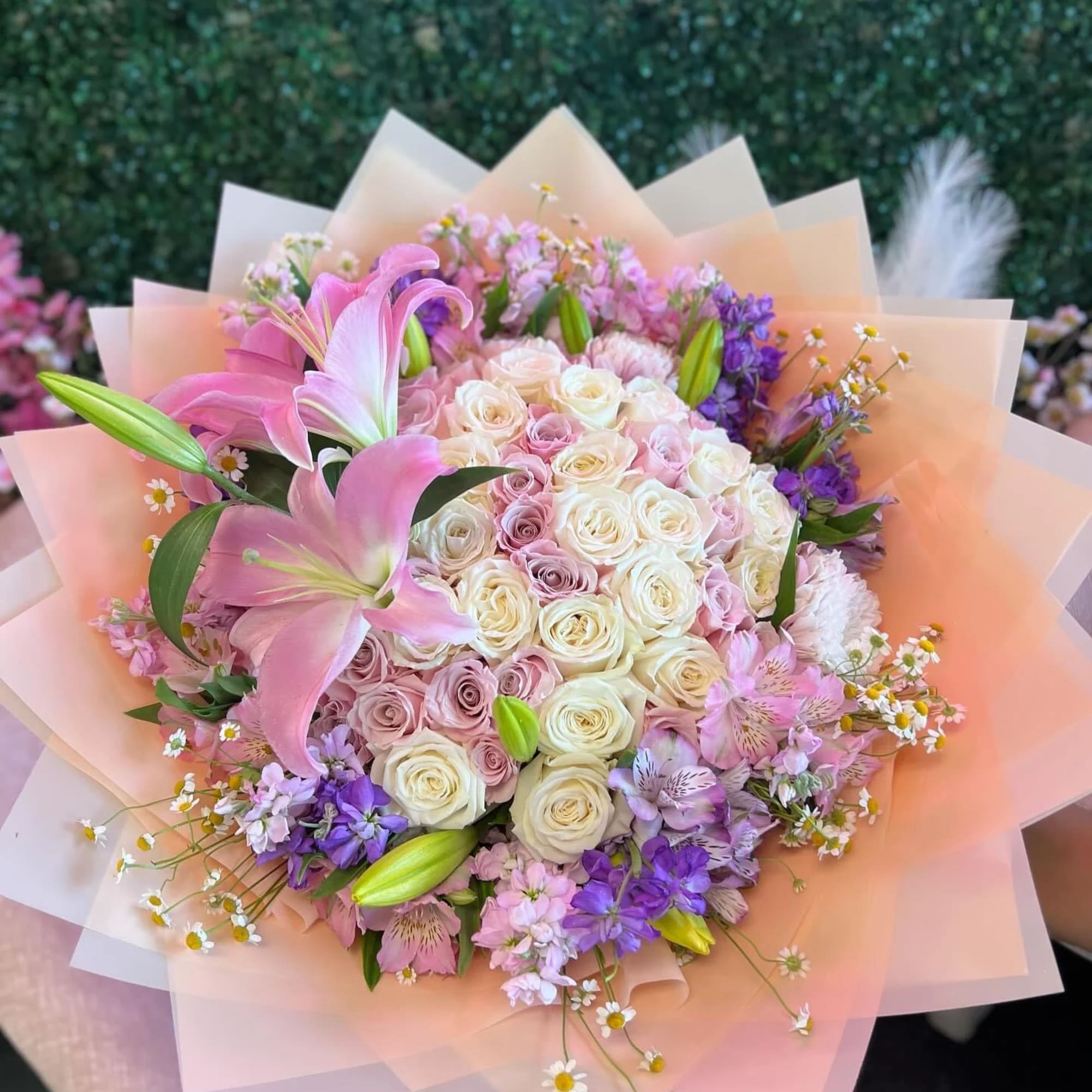 This exquisite bouquet features an enchanting array of pastel-colored roses, each blossom
