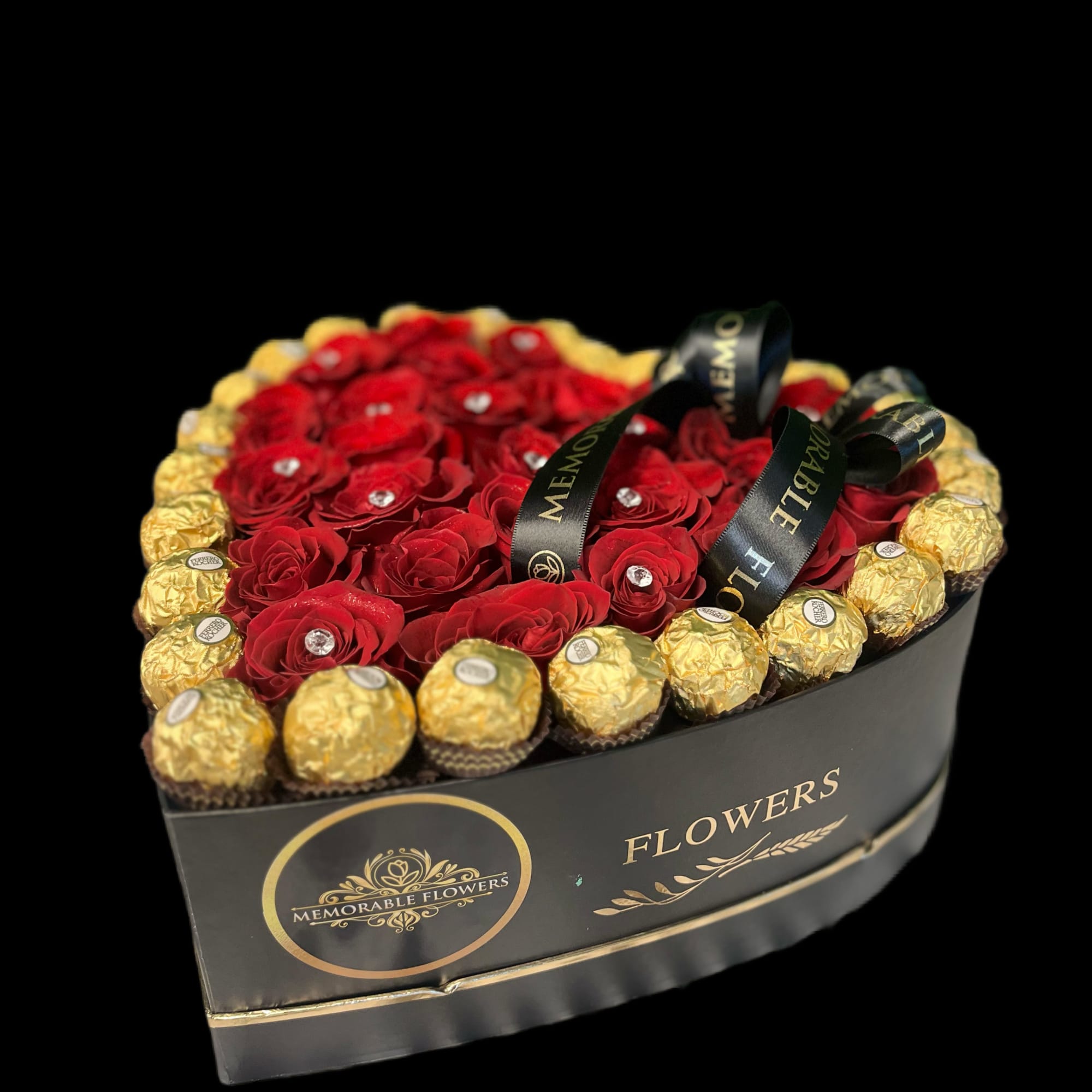 Heart-shaped box of red roses bordered by gold-wrapped chocolates