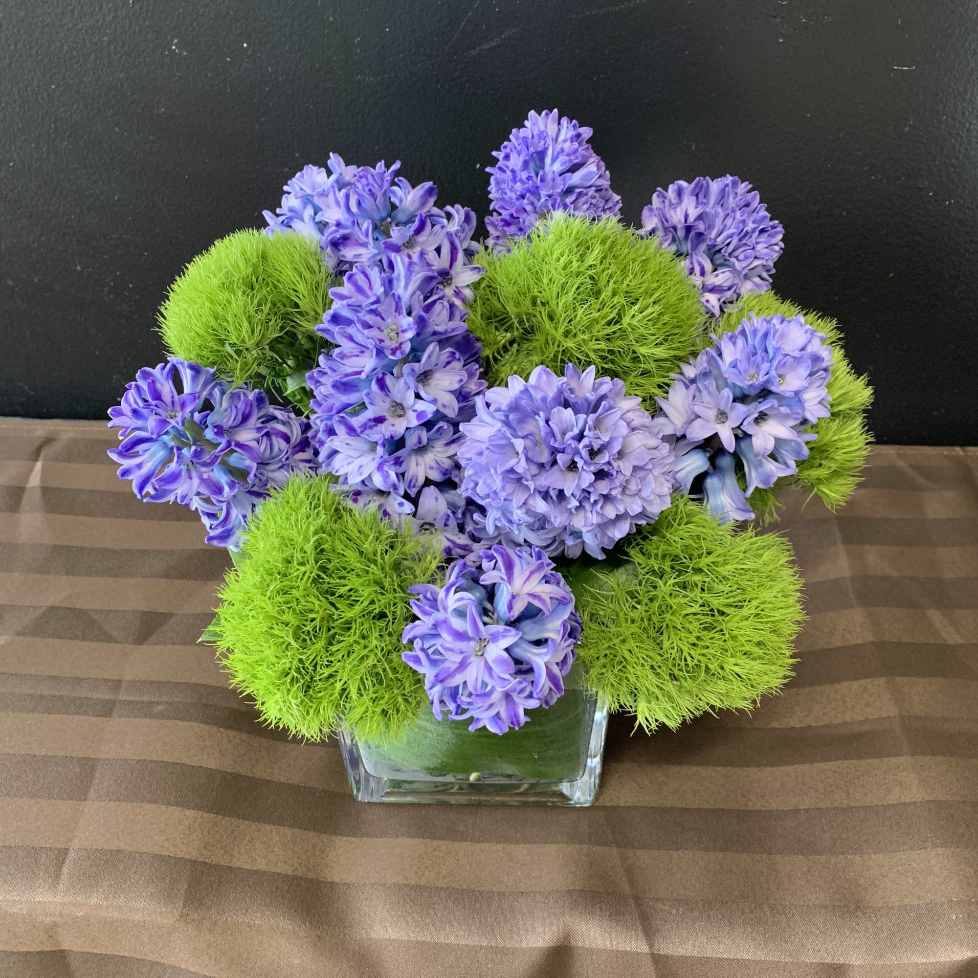 A lovely flower arrangement with hyacinth and dianthus.
this arrangement is available in
