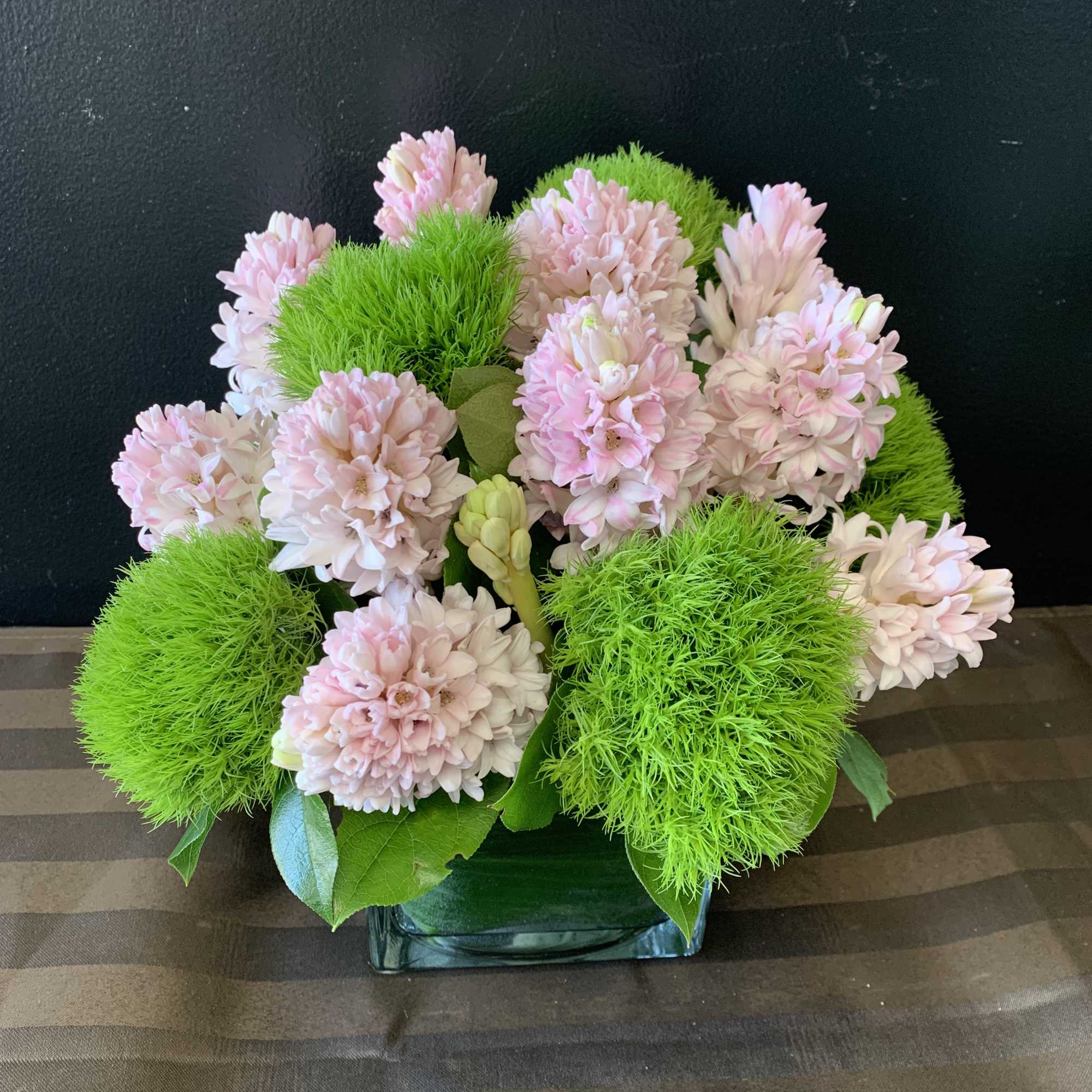 A lovely flower arrangement with hyacinth and dianthus.
this arrangement is available in