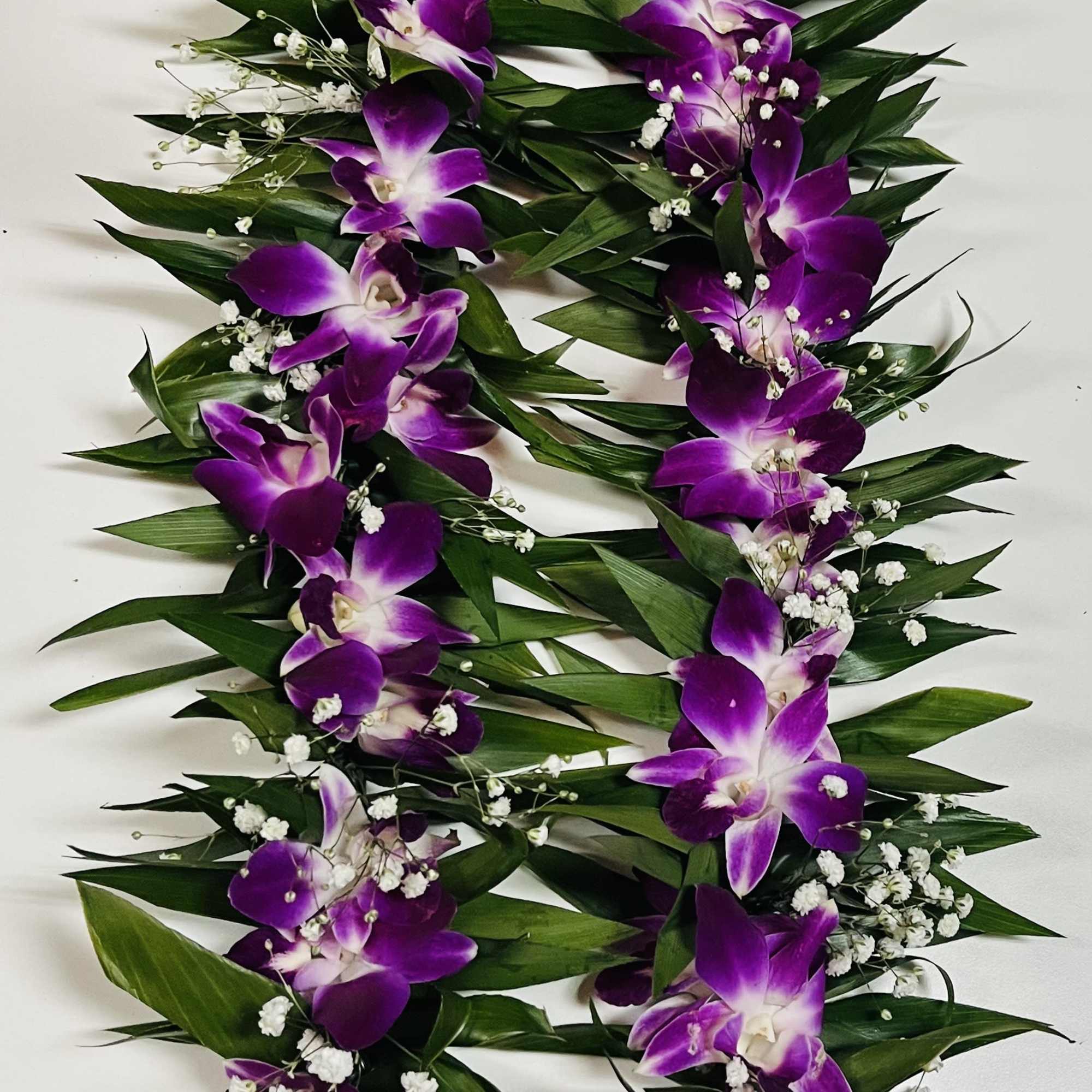 Experience using our handmade fresh double Ti-Leaves Maile Lei, a refined alternative