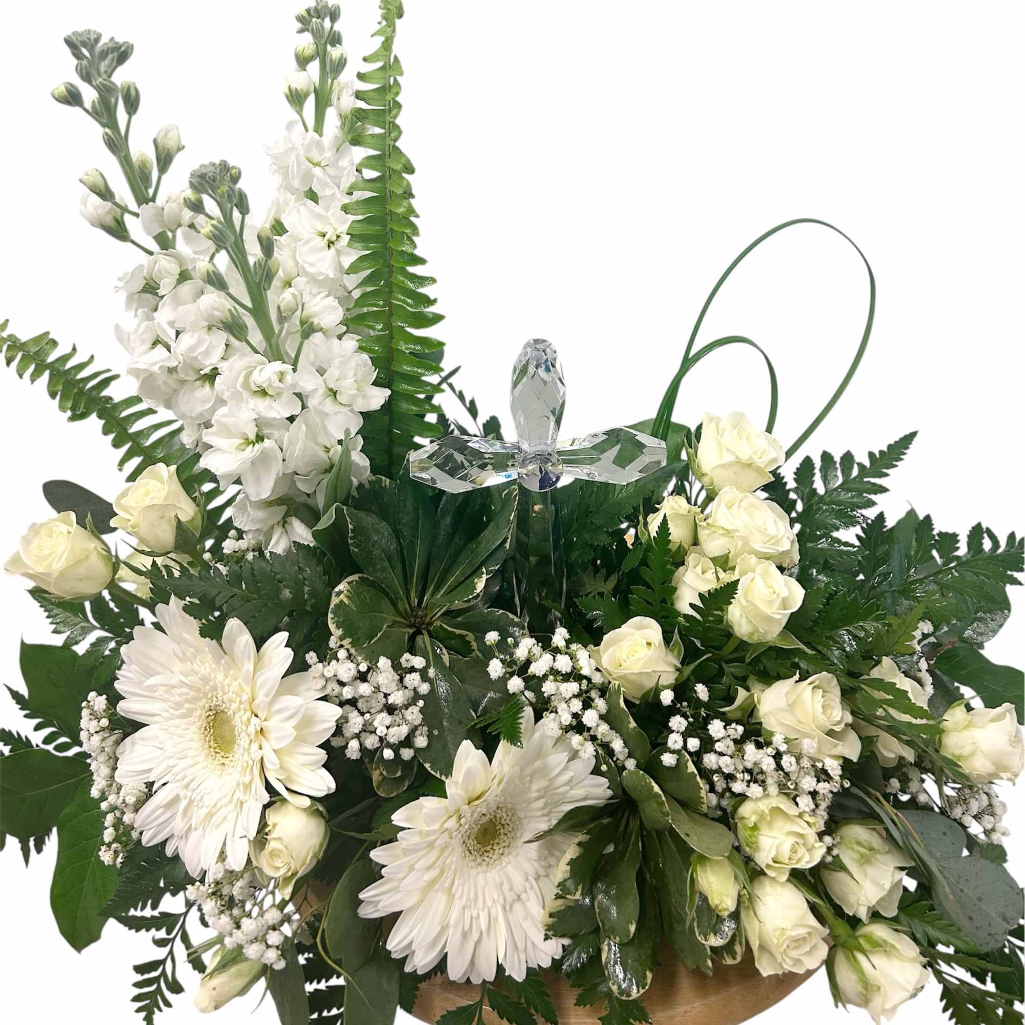 A serene white-and-green sympathy arrangement centered around a crystal cross keepsake creates
