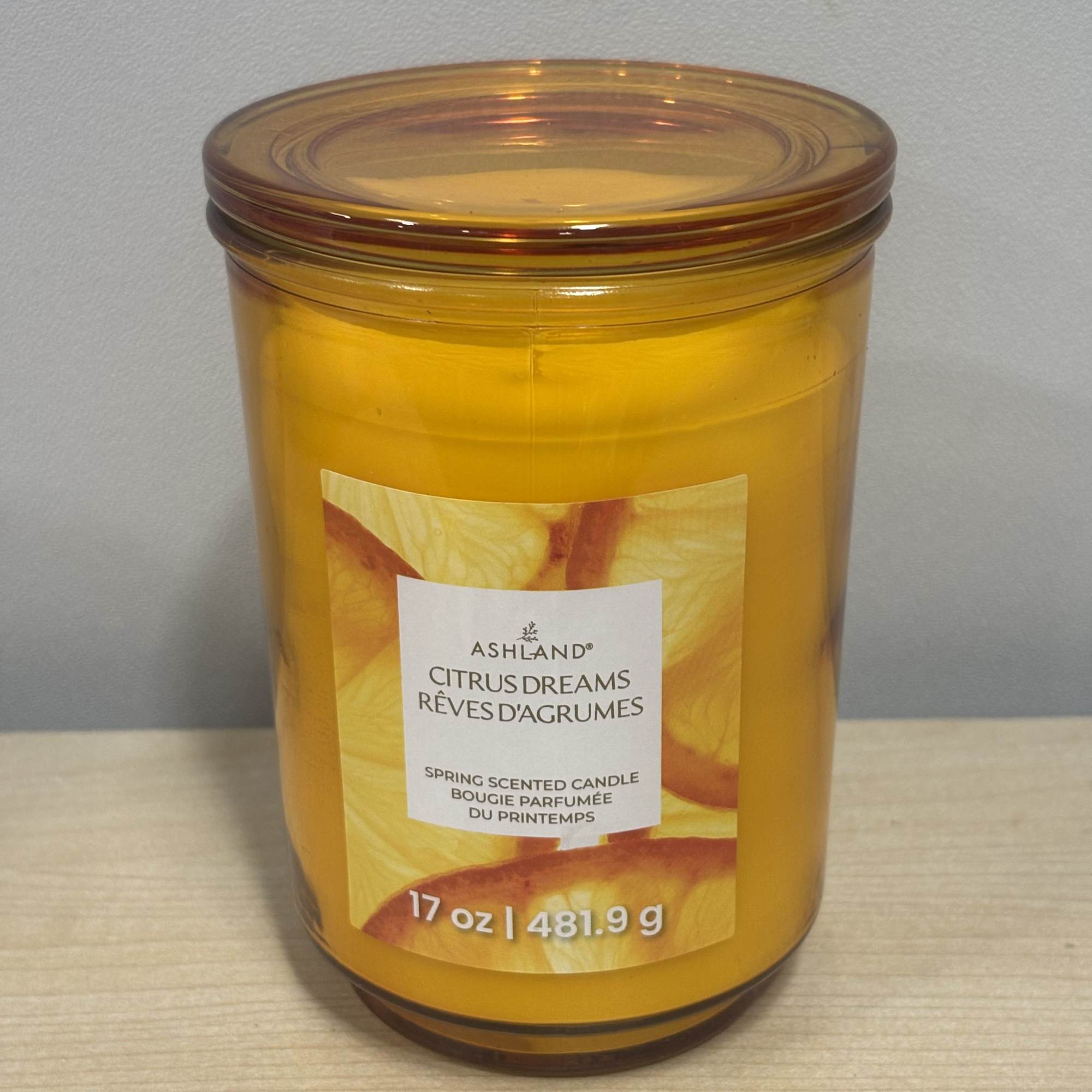 A vibrant yellow Phalaenopsis orchid planted in a tall navy metal pot