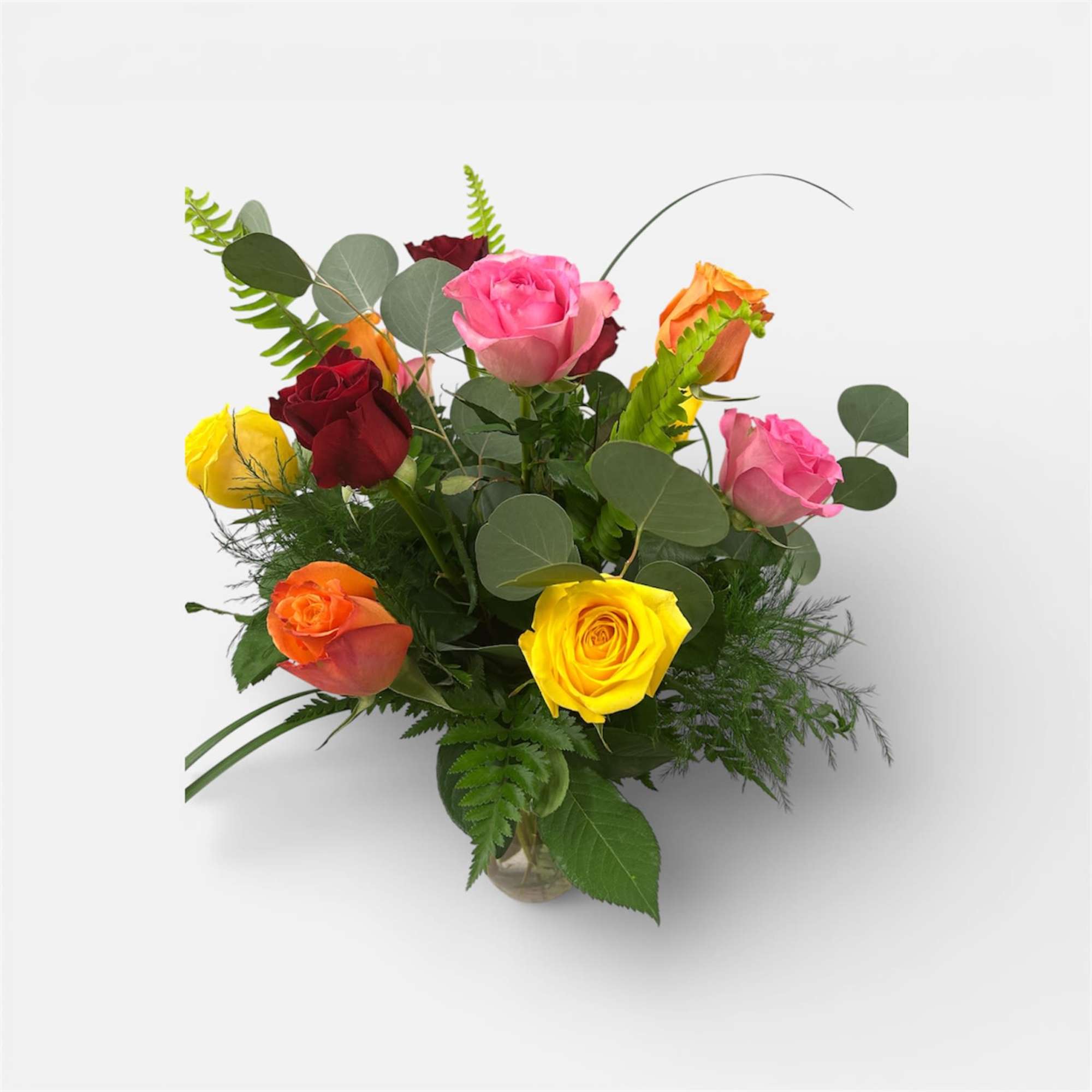 A bright cluster of red, yellow, pink, and orange roses arranged in