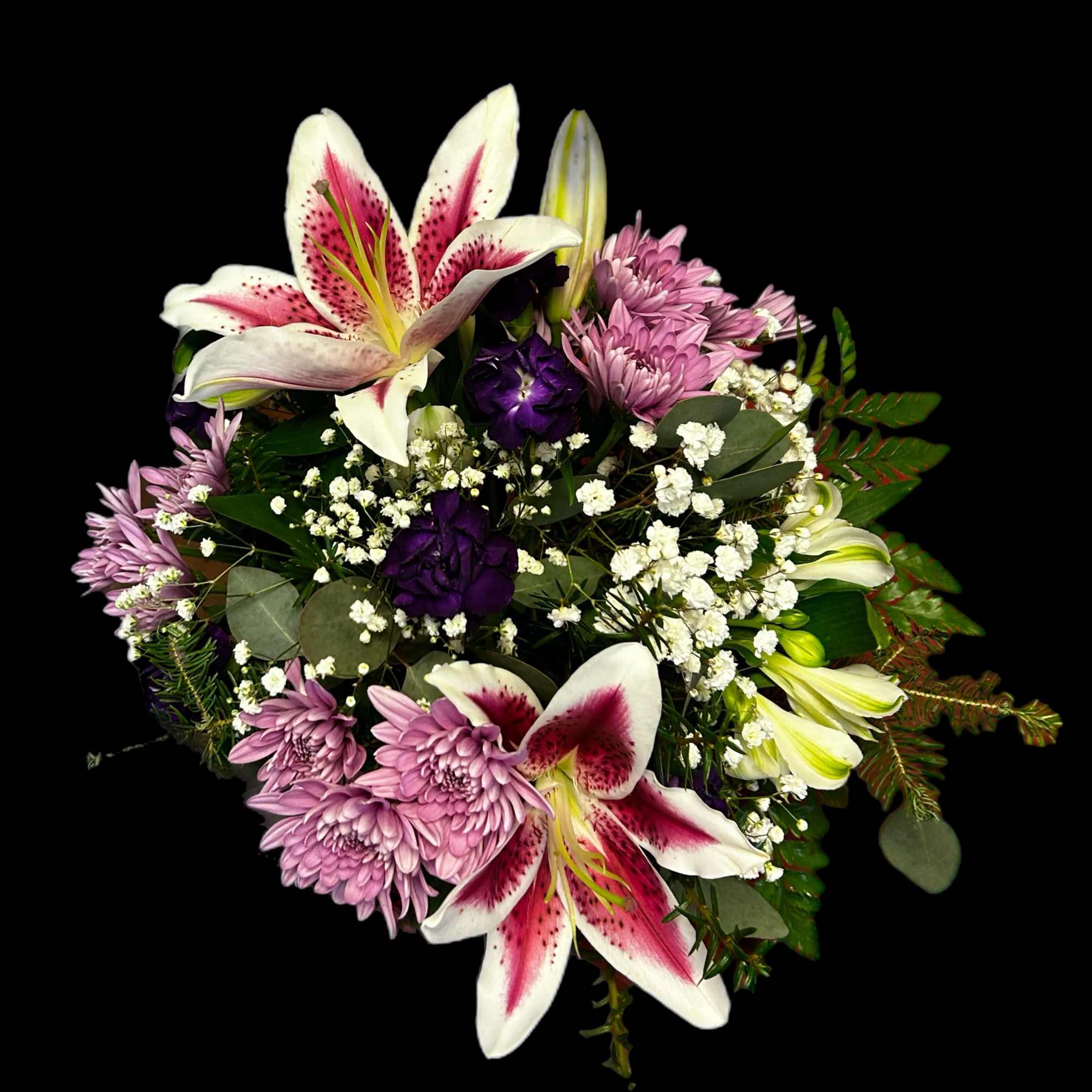 Hand-tied bouquet with pink stargazer lilies, lavender mums, purple blooms, and white filler flowers.