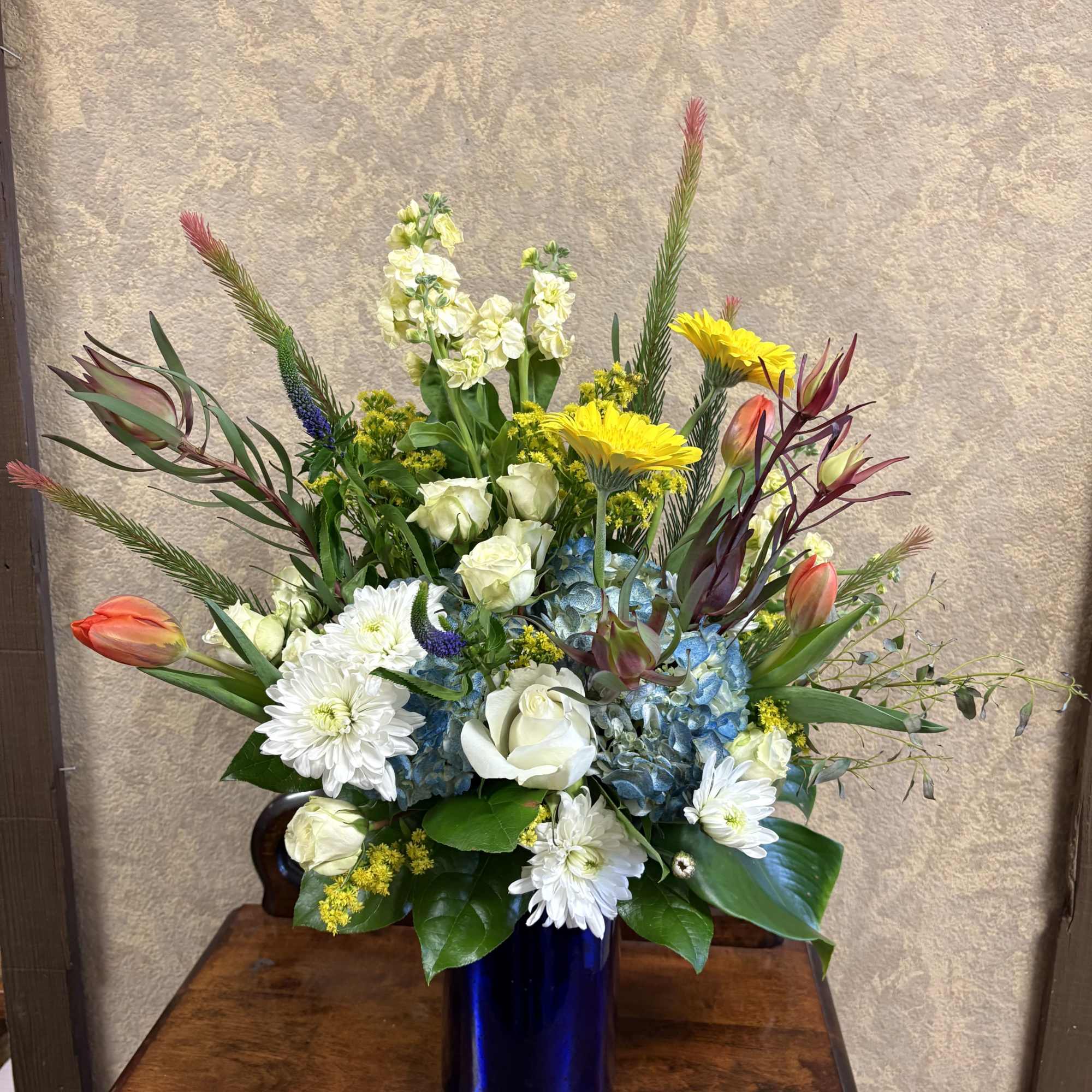 Recipe: Yellow Snapdragons, White Roses, Yellow Tulips, Orange Gerbera Daisies, Leucadendron Conebush