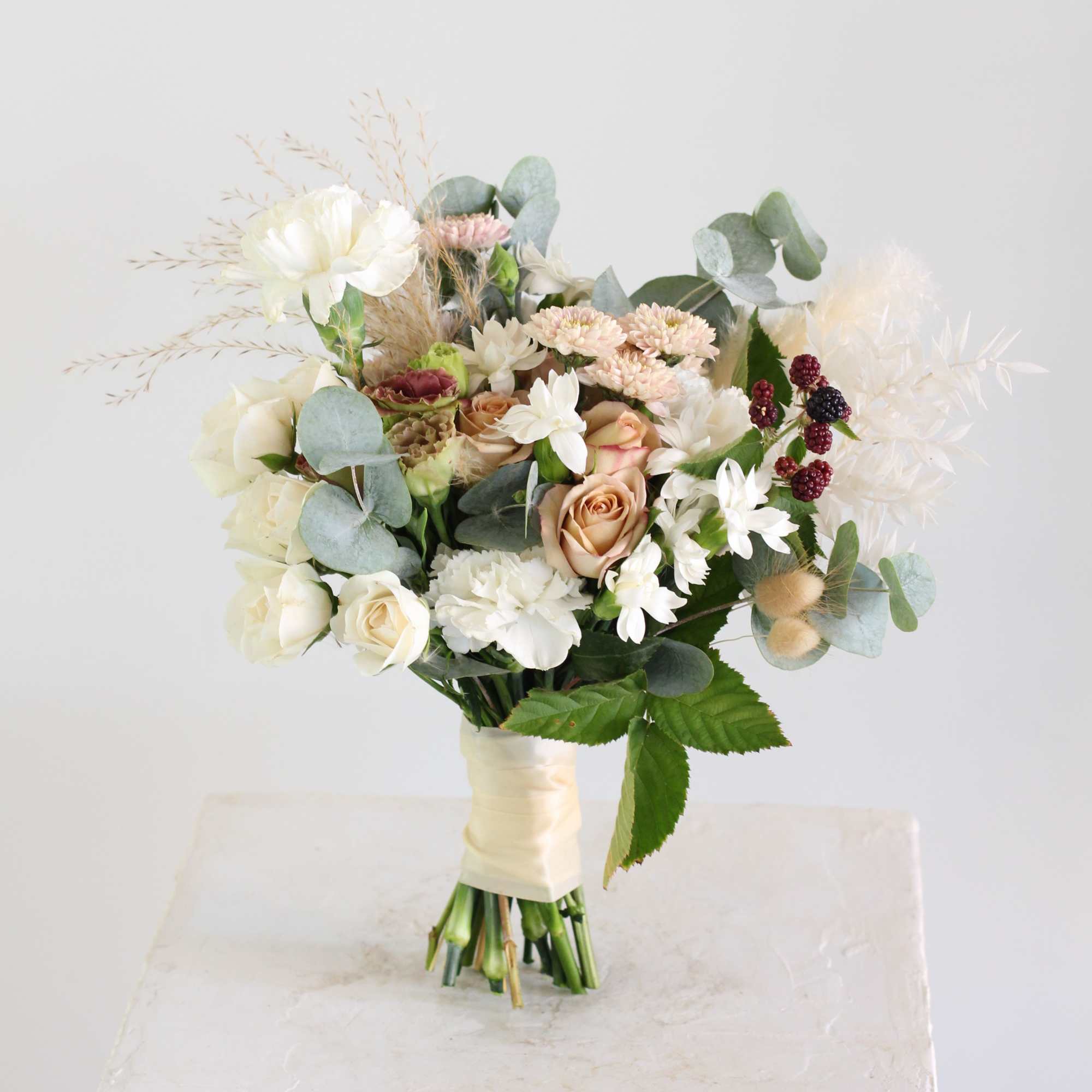 Ribbon-wrapped bouquet and matching boutonniere in your choice of colors. Please specify