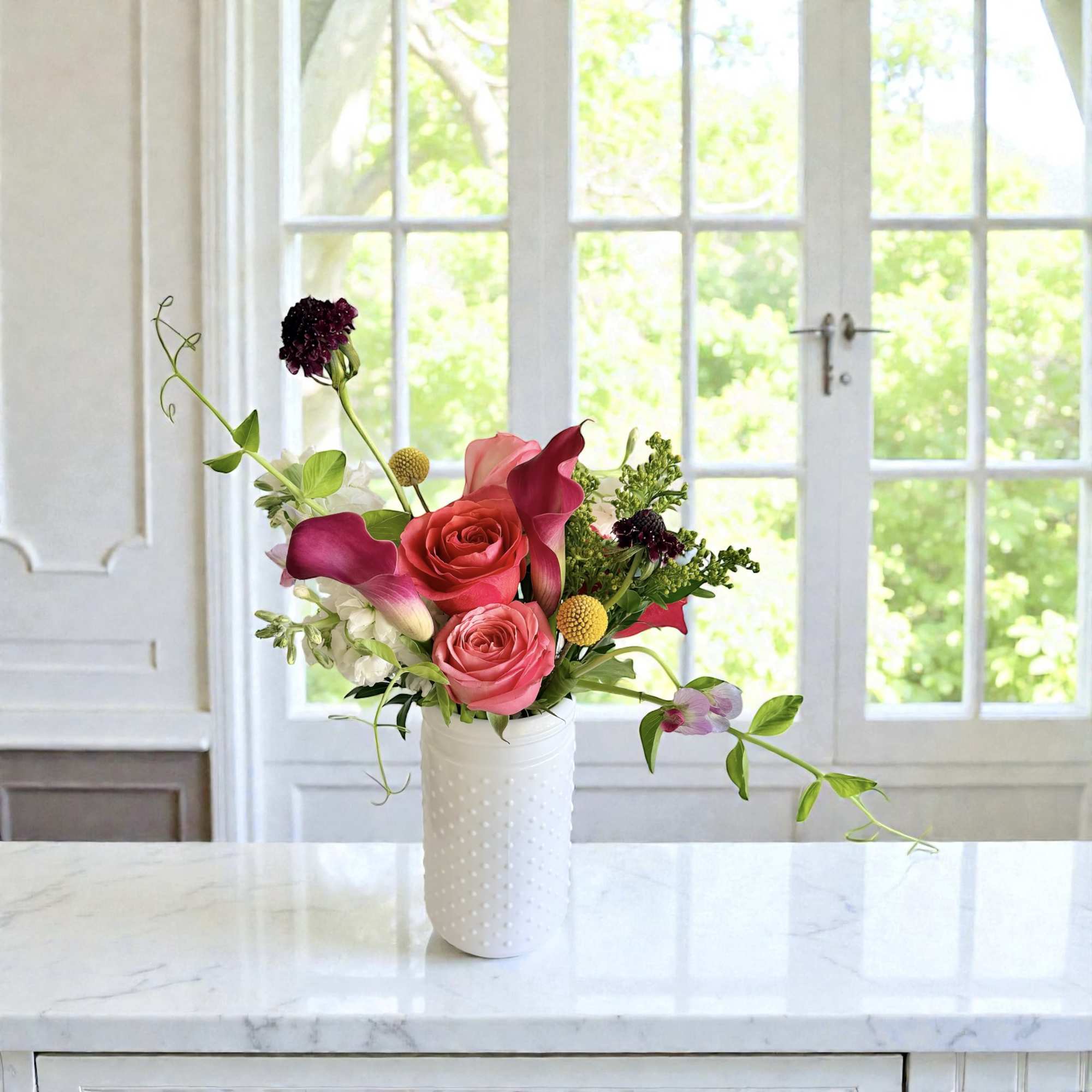 Petite yet full of happiness in a hobnail  or glass vase.