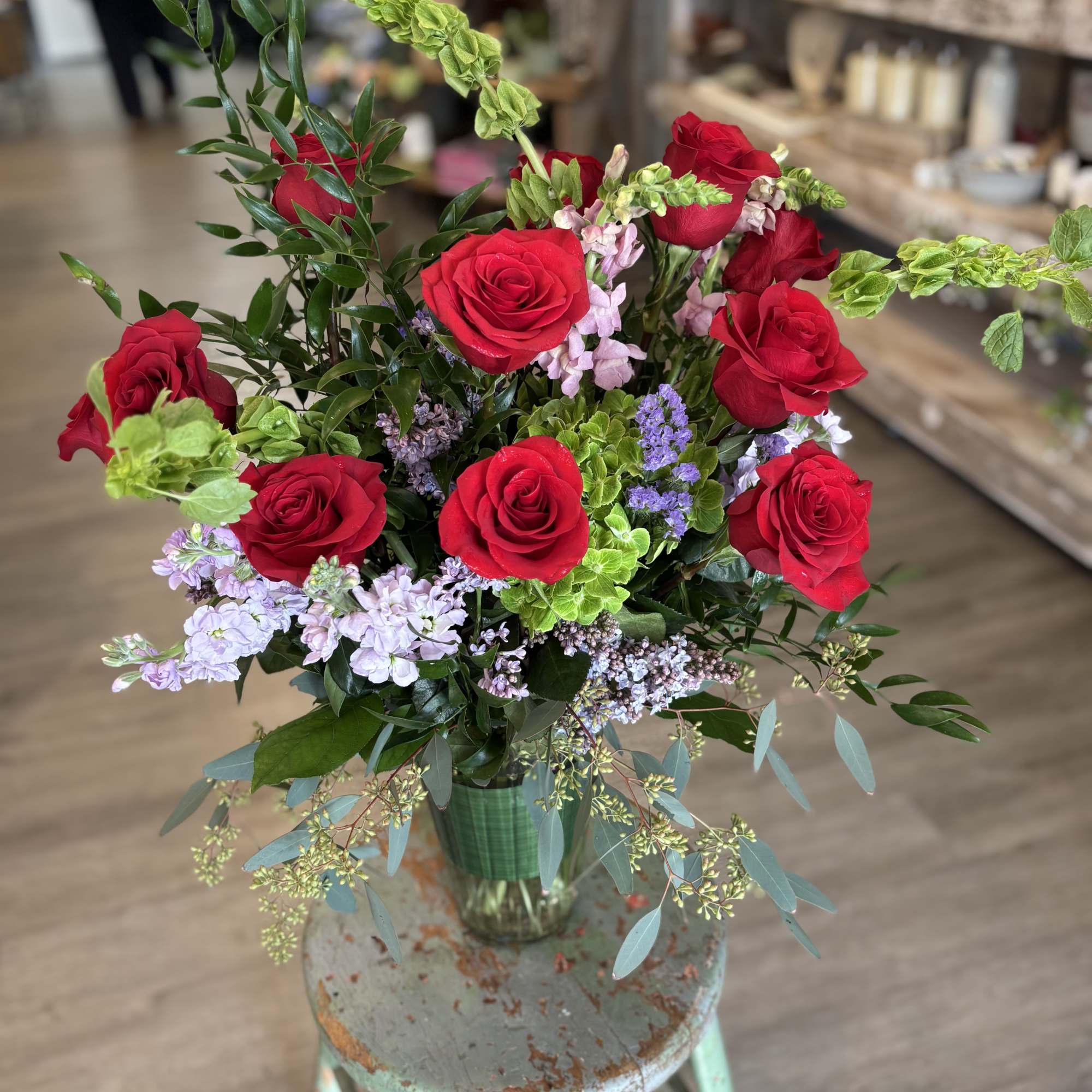 A fresh take on the classic dozen - luxurious red roses designed