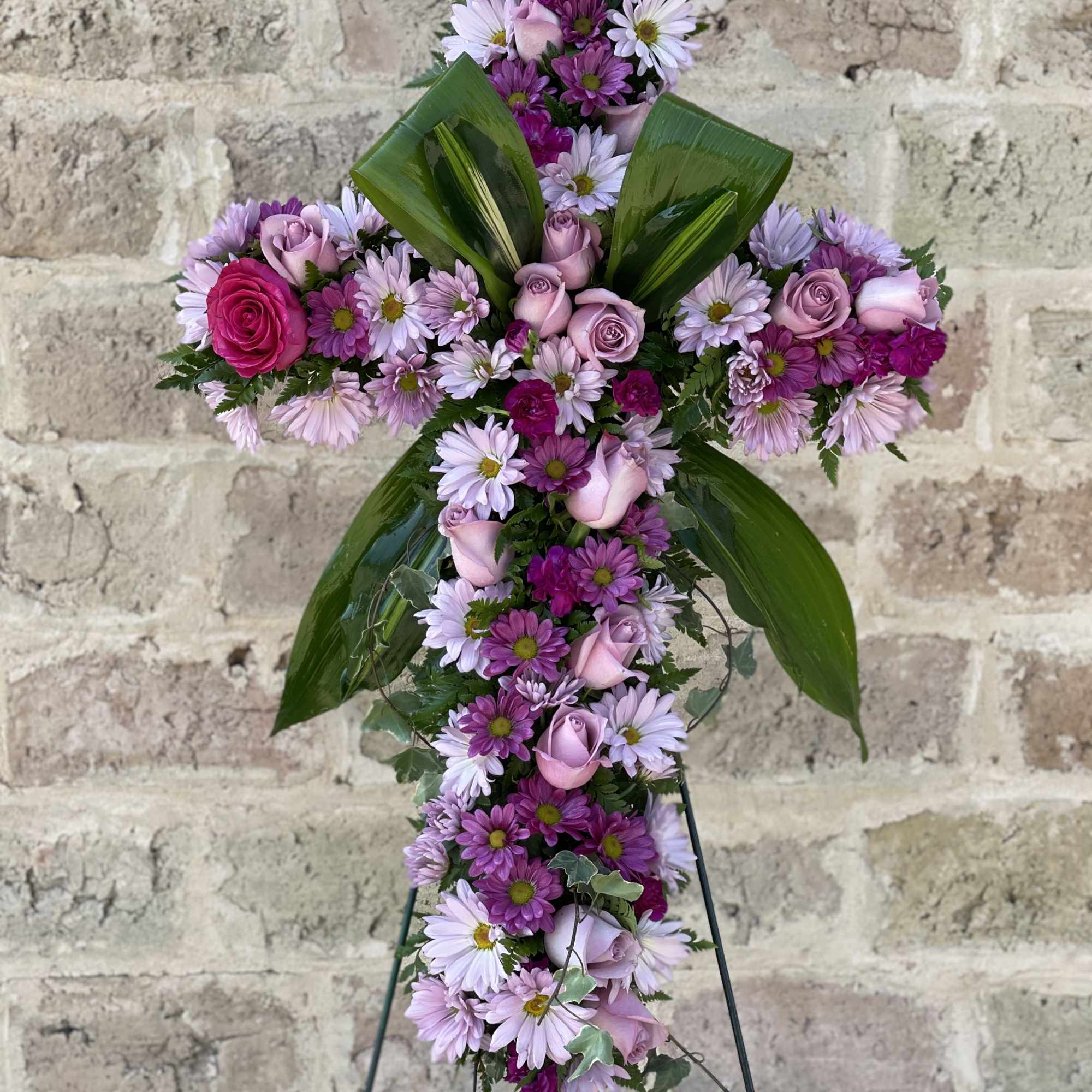 Praise your loved one with a floral cross that truly represents their