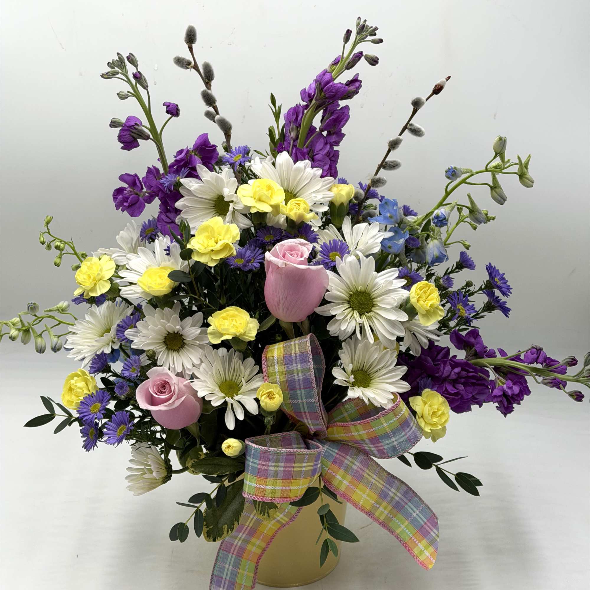 Soft, whimsical and full of springtime charm, this garden-style arrangement feels like