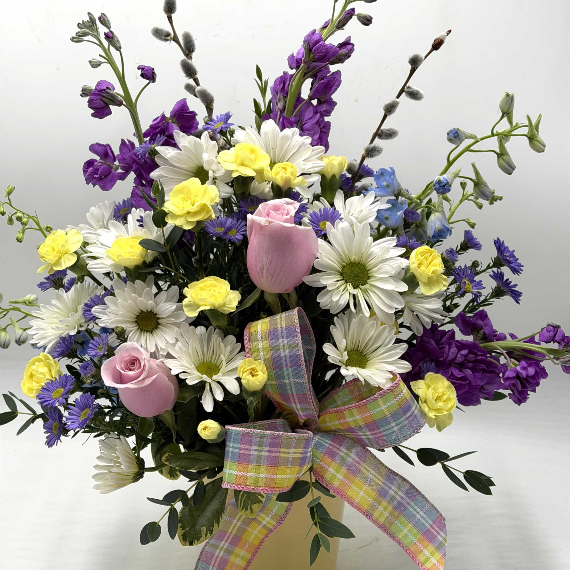 Soft, whimsical and full of springtime charm, this garden-style arrangement feels like