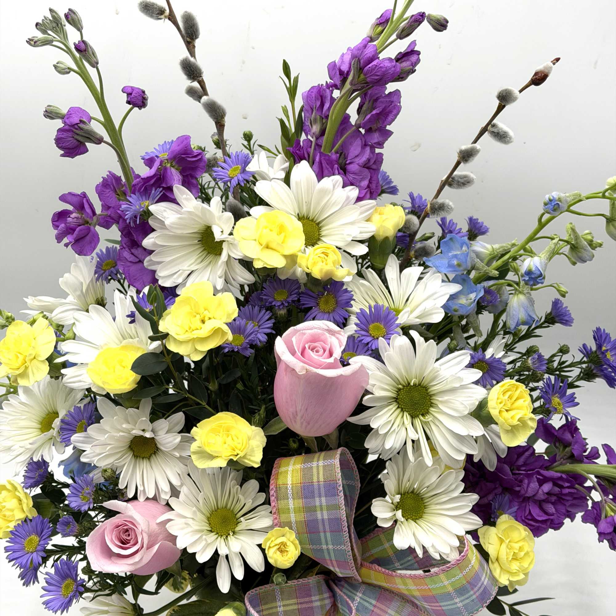 Soft, whimsical and full of springtime charm, this garden-style arrangement feels like