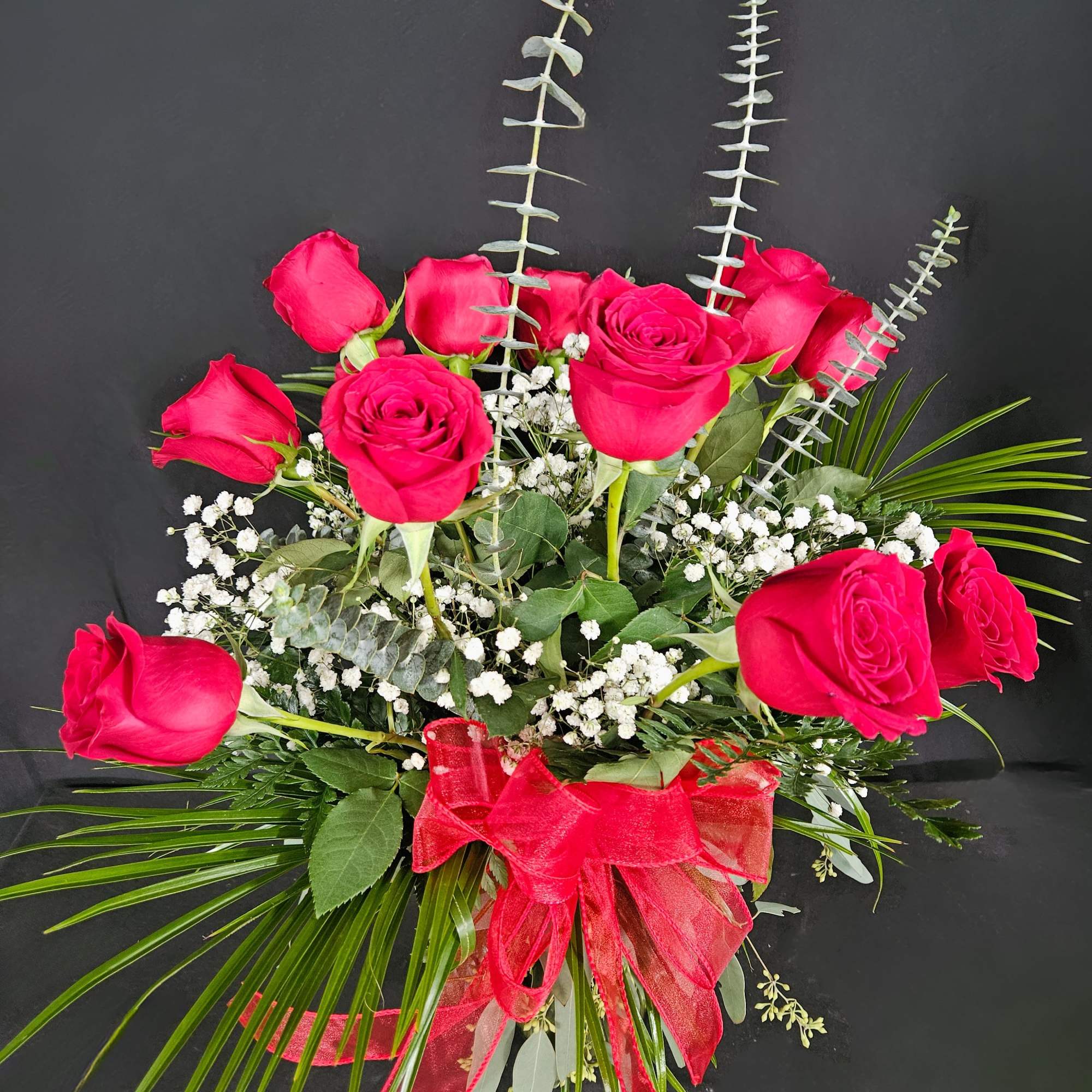 These dozen red roses with baby's breath are a classic! Perfect romantic