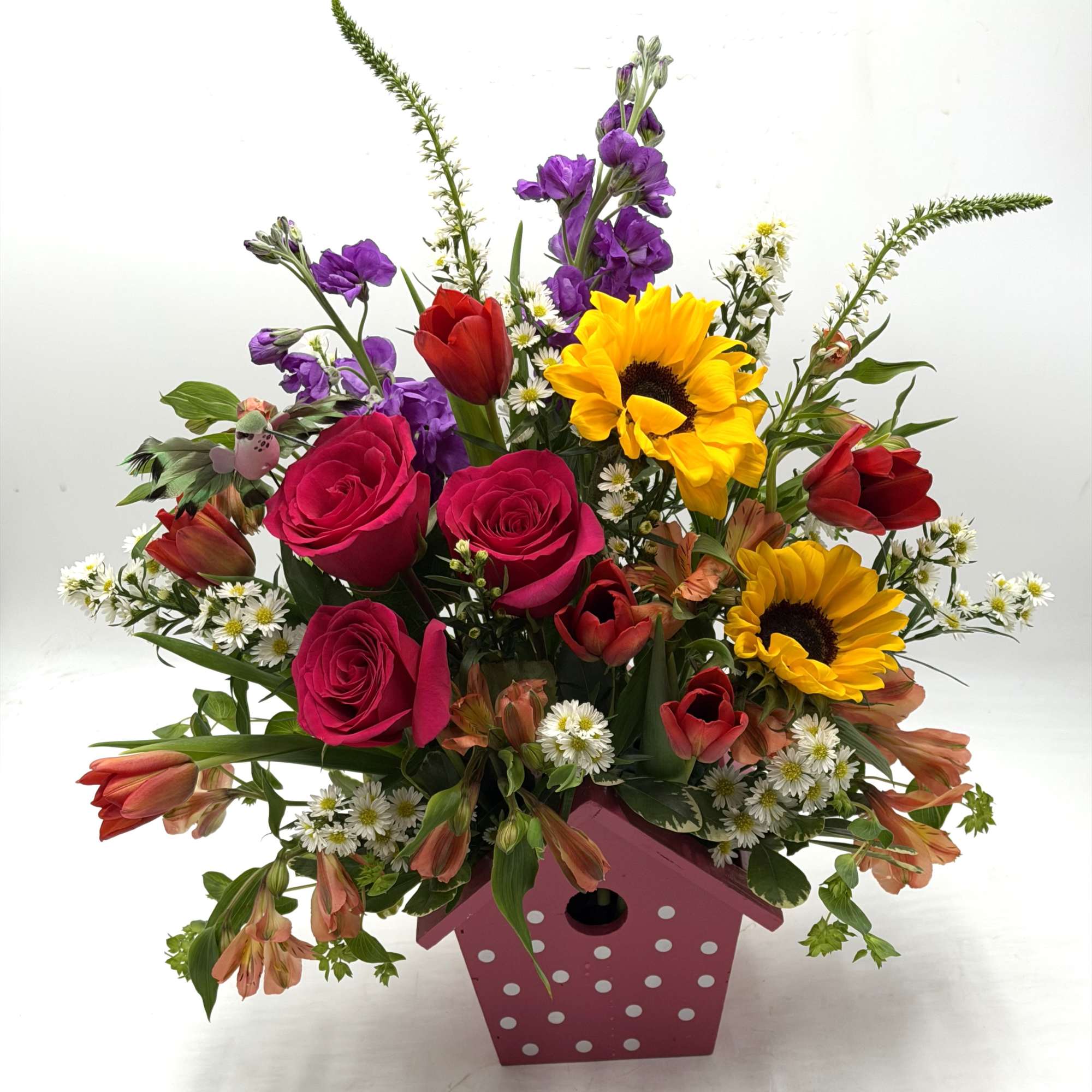 A cheerful, garden - inspired arrangement bursting with color and charm artfully
