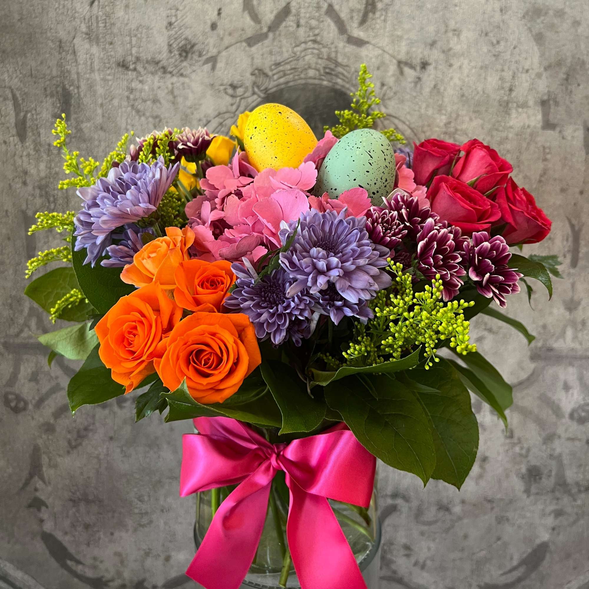 This delightful arrangement of colorful spring flowers is just what the Easter