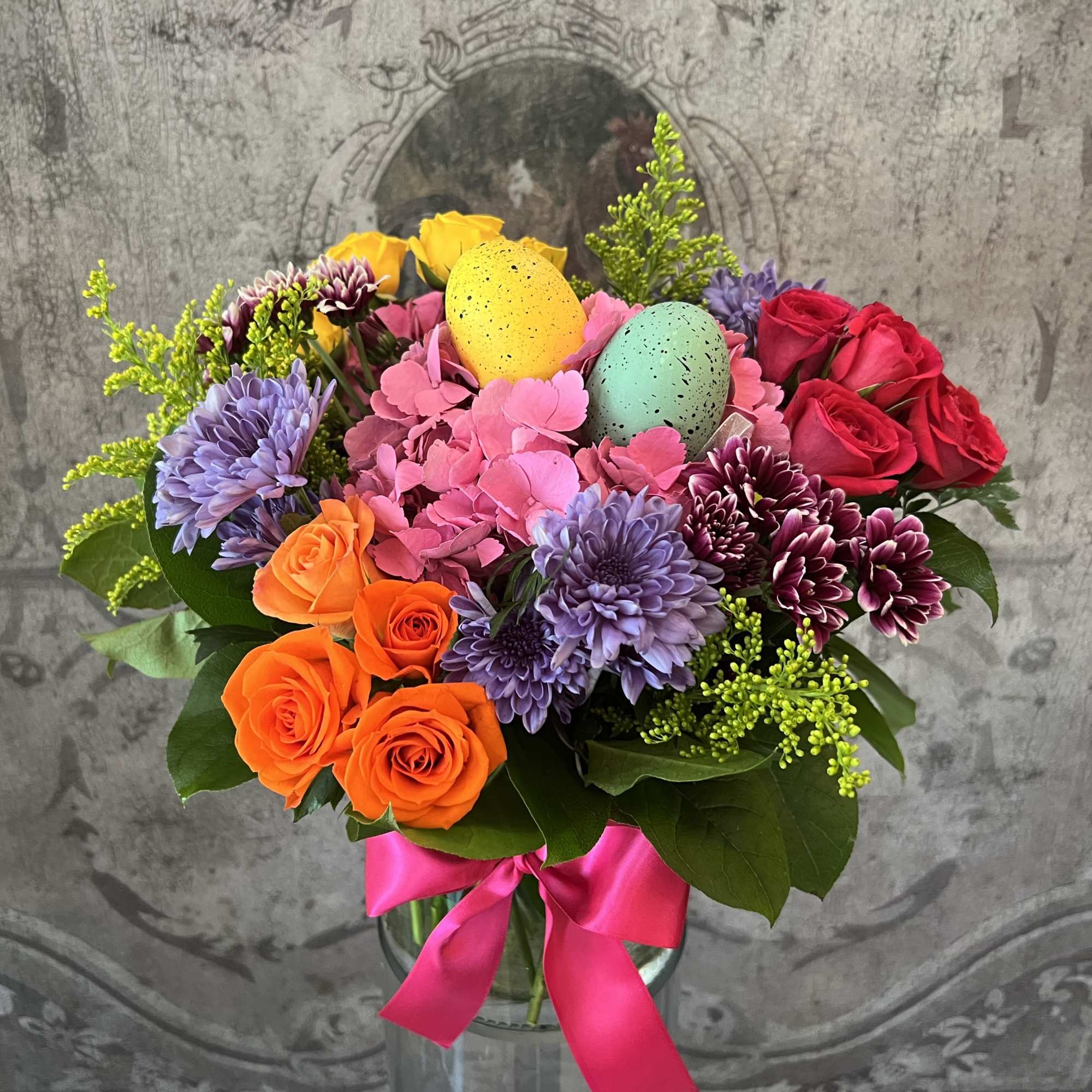 This delightful arrangement of colorful spring flowers is just what the Easter