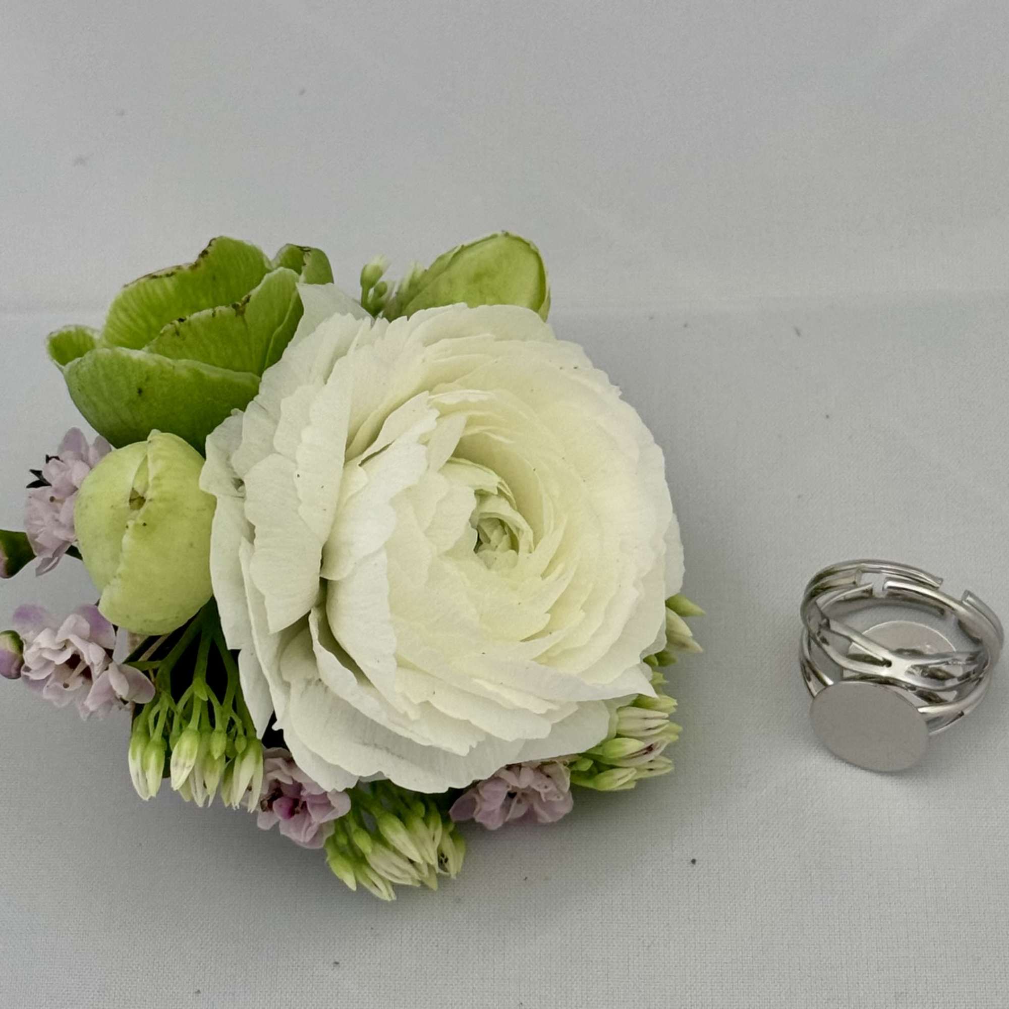 Floral Corsage Rings are a modern, stylish alternative to traditional wrist corsages.