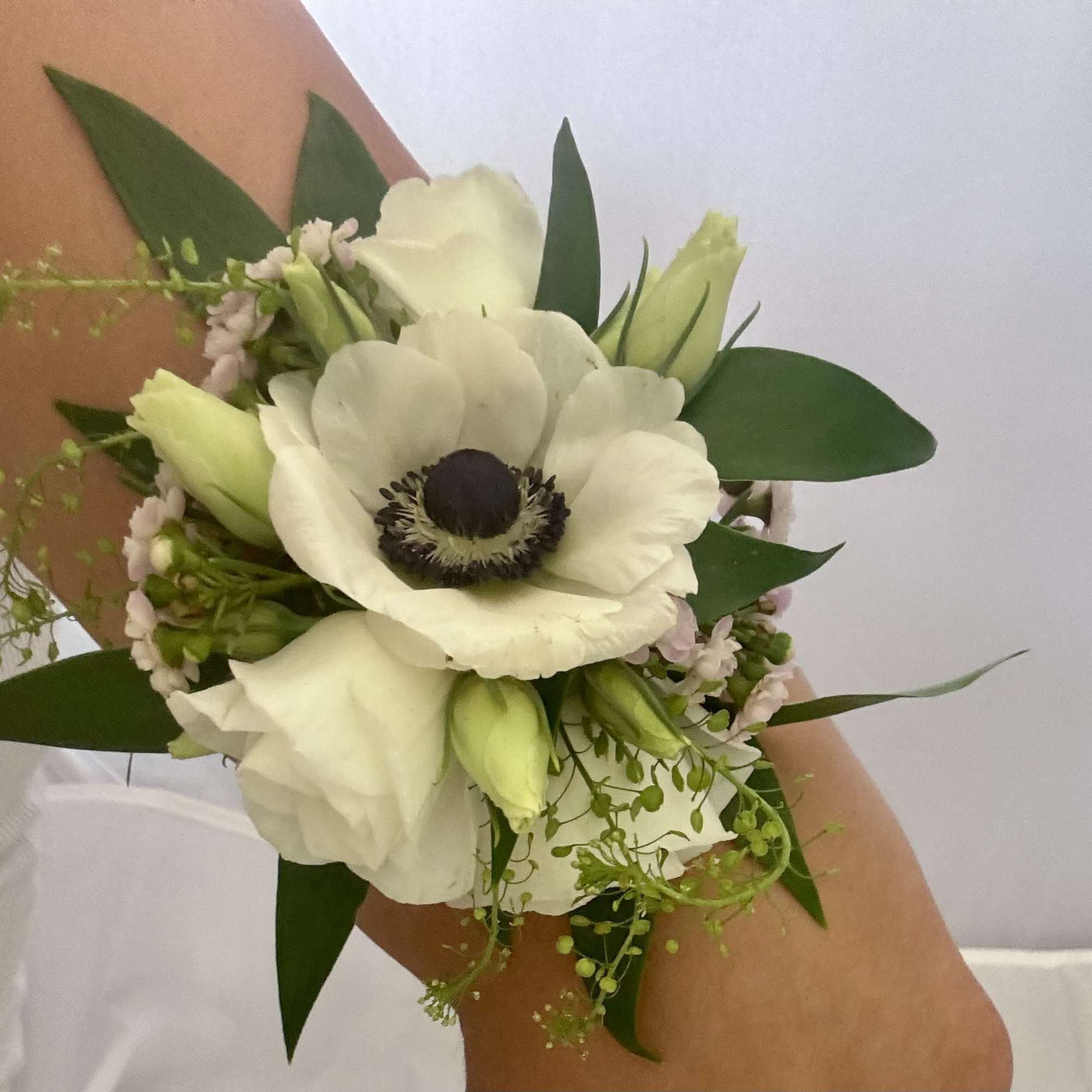 Redefine the classic corsage with a modern, wearable statement piece. Our Floral