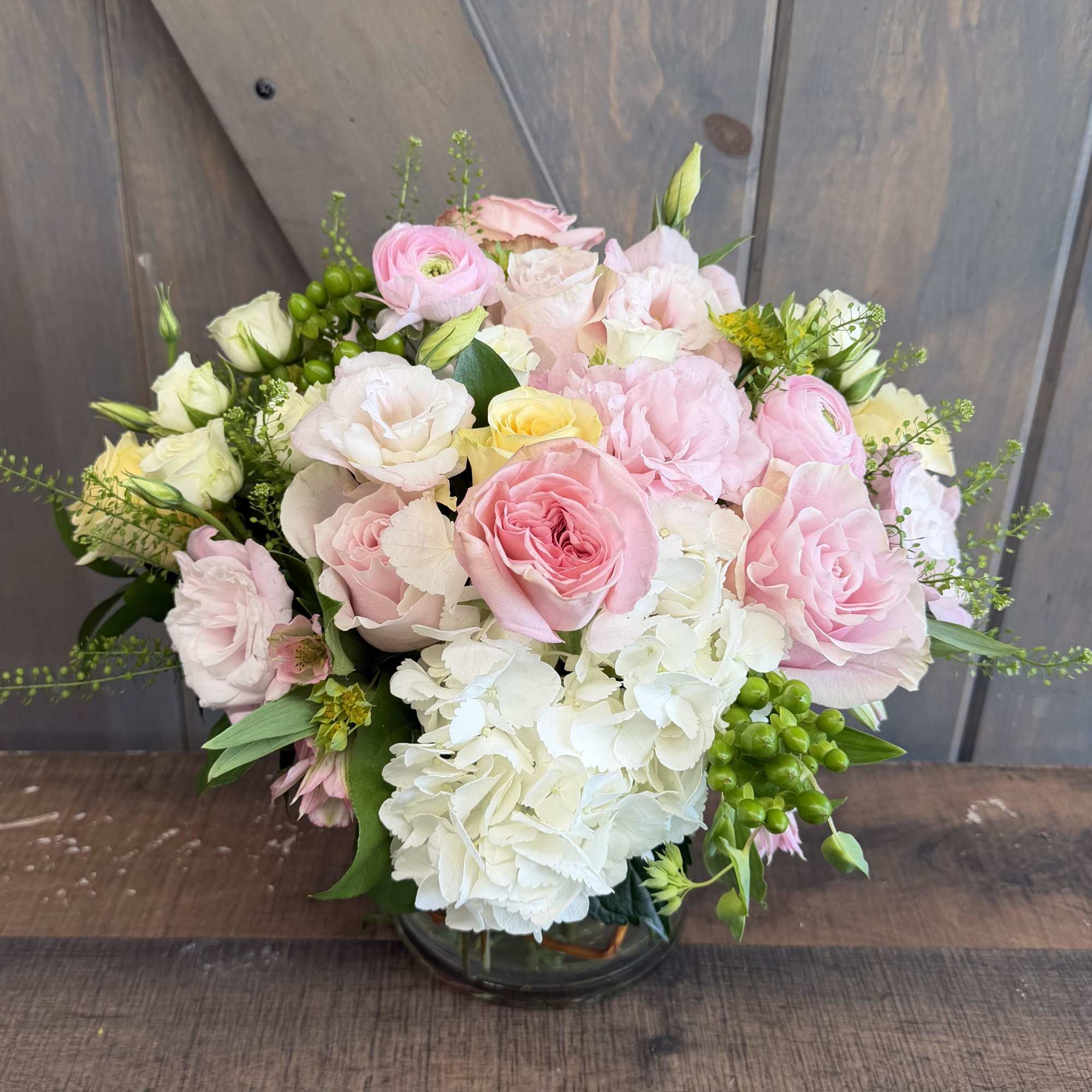 A soft, romantic composition designed to feel effortless and full. This arrangement