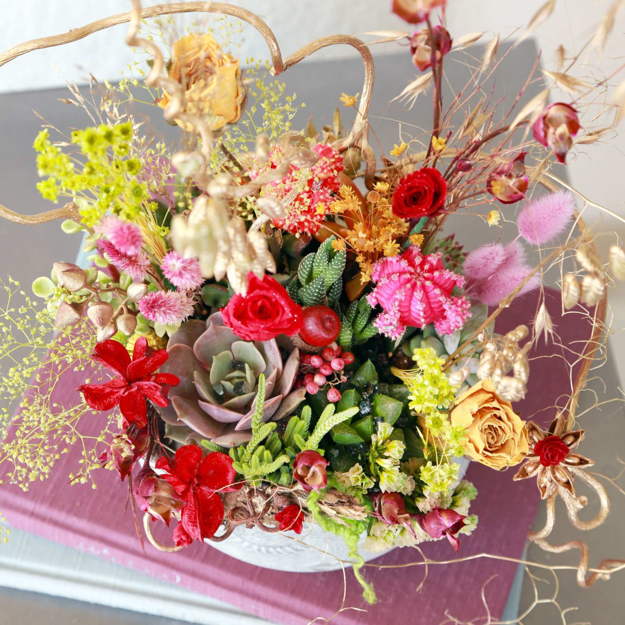 Our bestselling Assorted Succulent arranged in 7" Smile face ceramic seafoam color