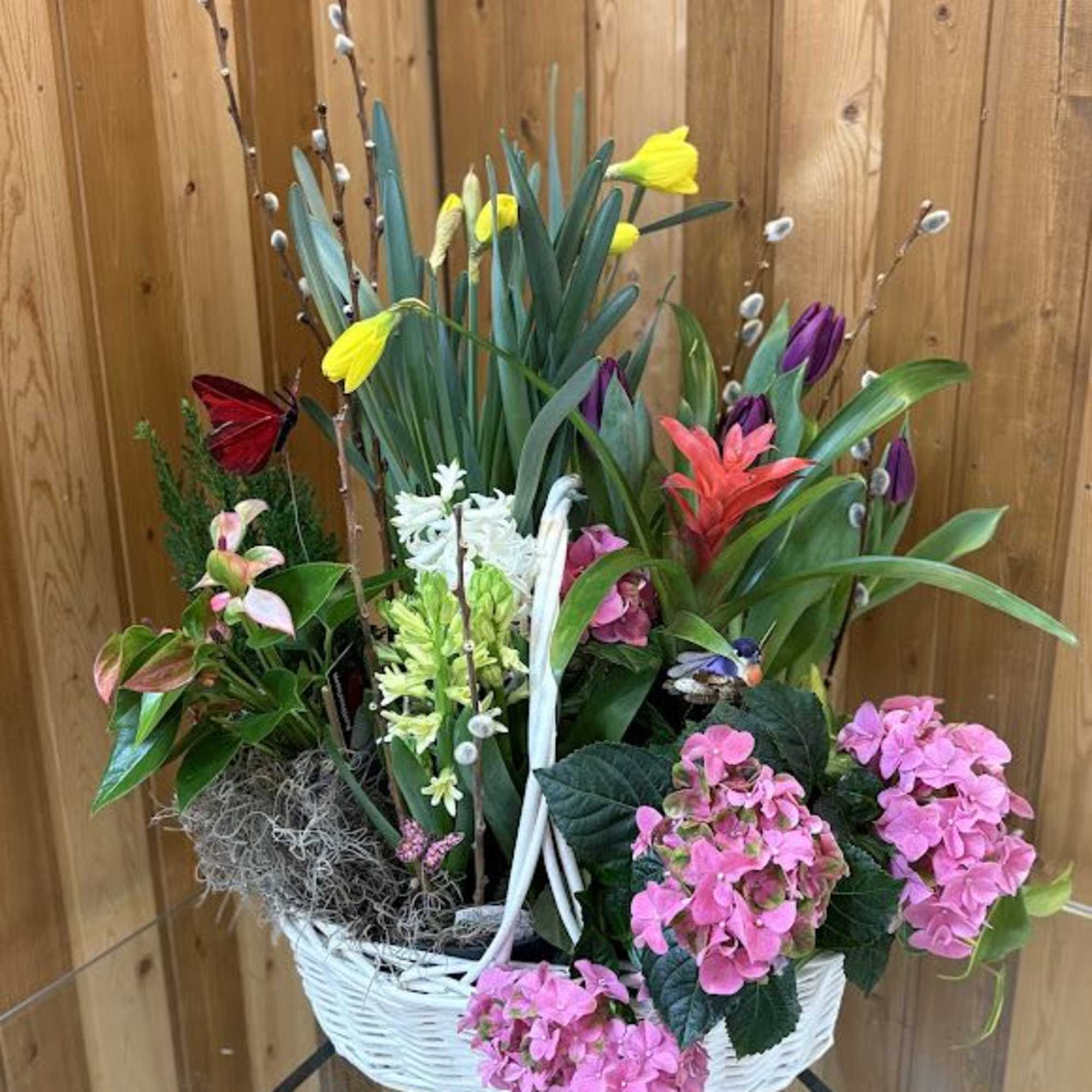 A fresh white wicker basket overflowing with blooming plants makes an unforgettable