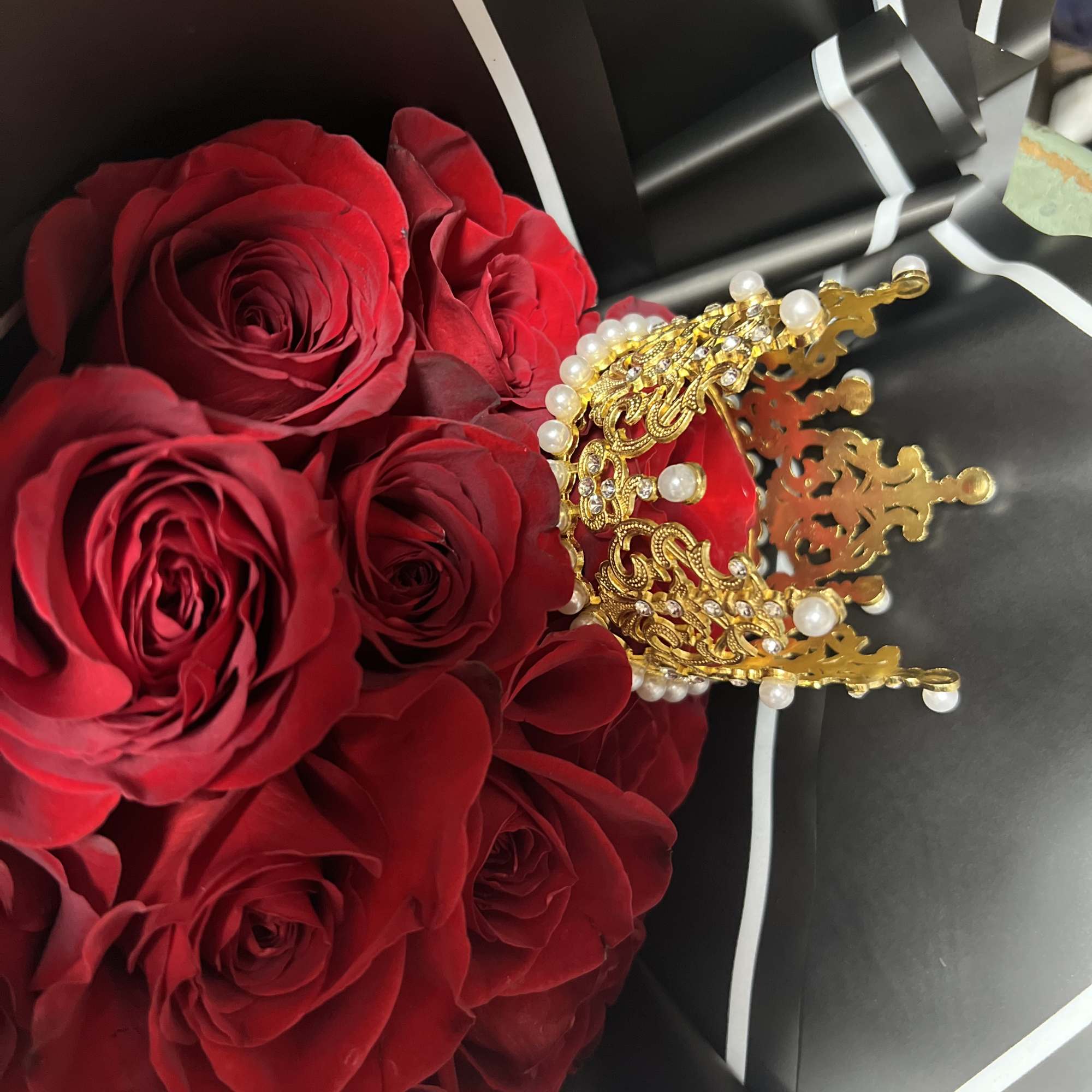 This Stunning  Wrapped Hand Held Rose Arrangement is fit for &ldquo;THE