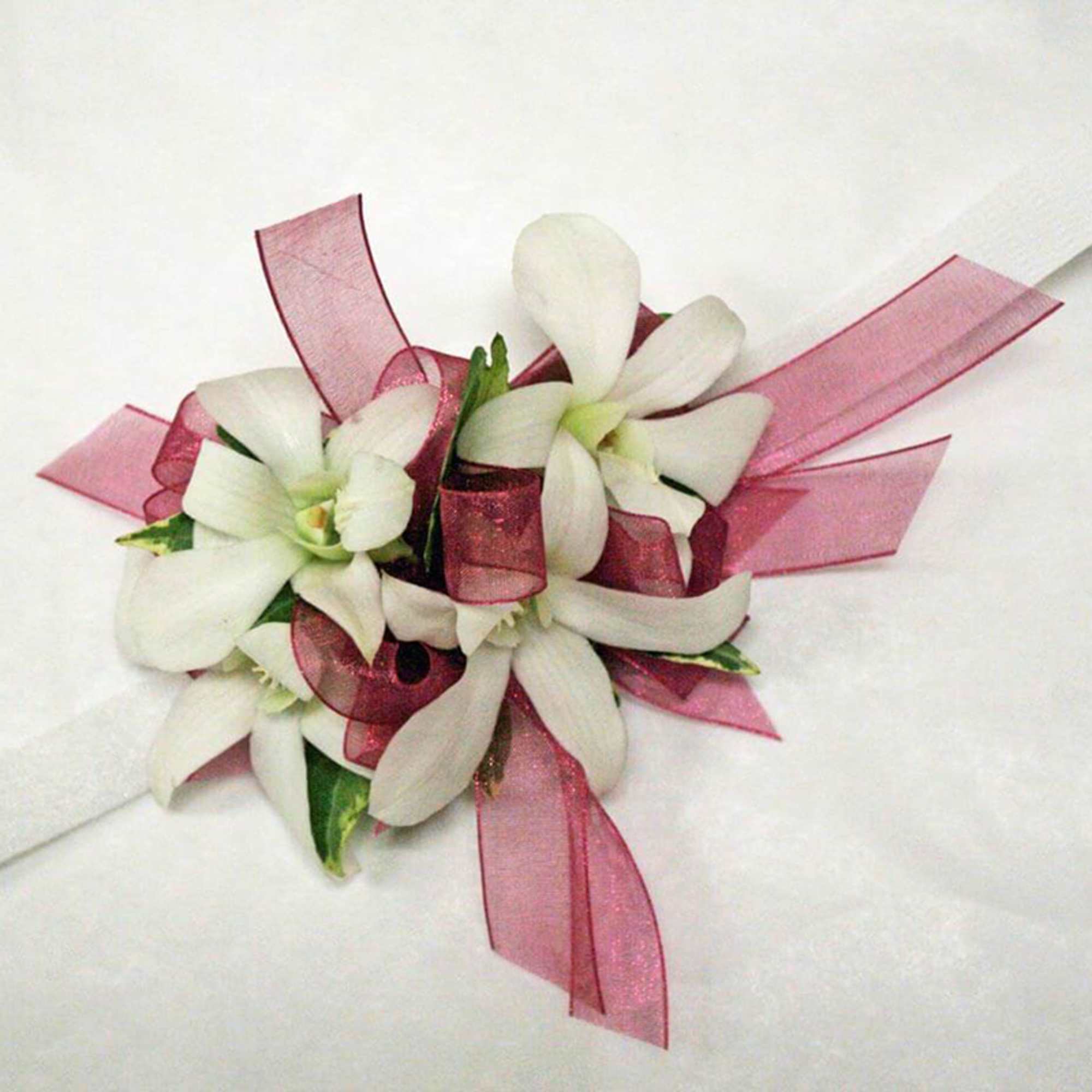 Elevate your formal look with our contemporary wristlet featuring elegant Dendrobium orchids.